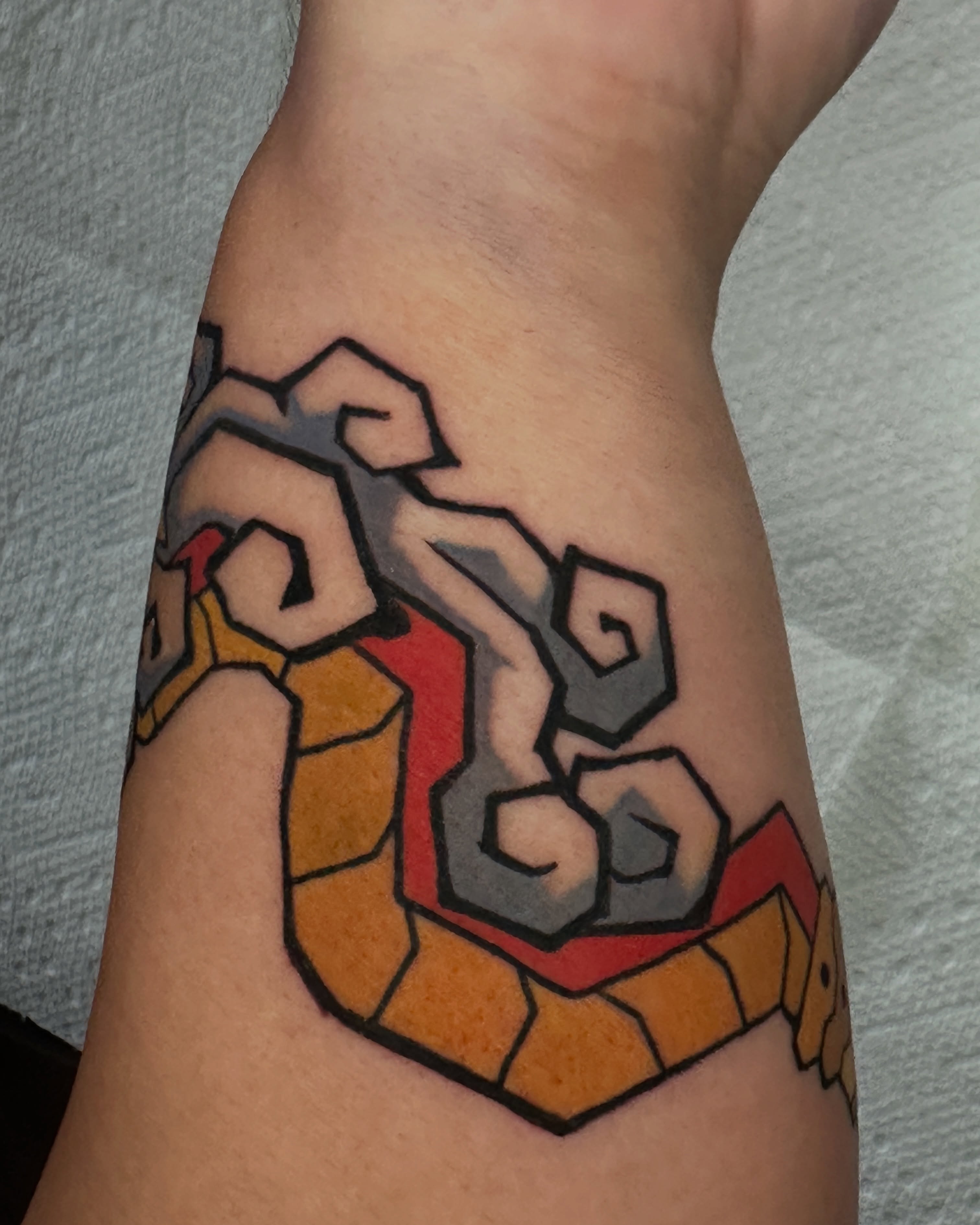 Geometric design geometric tattoo on the forearm by Dustin Hughes