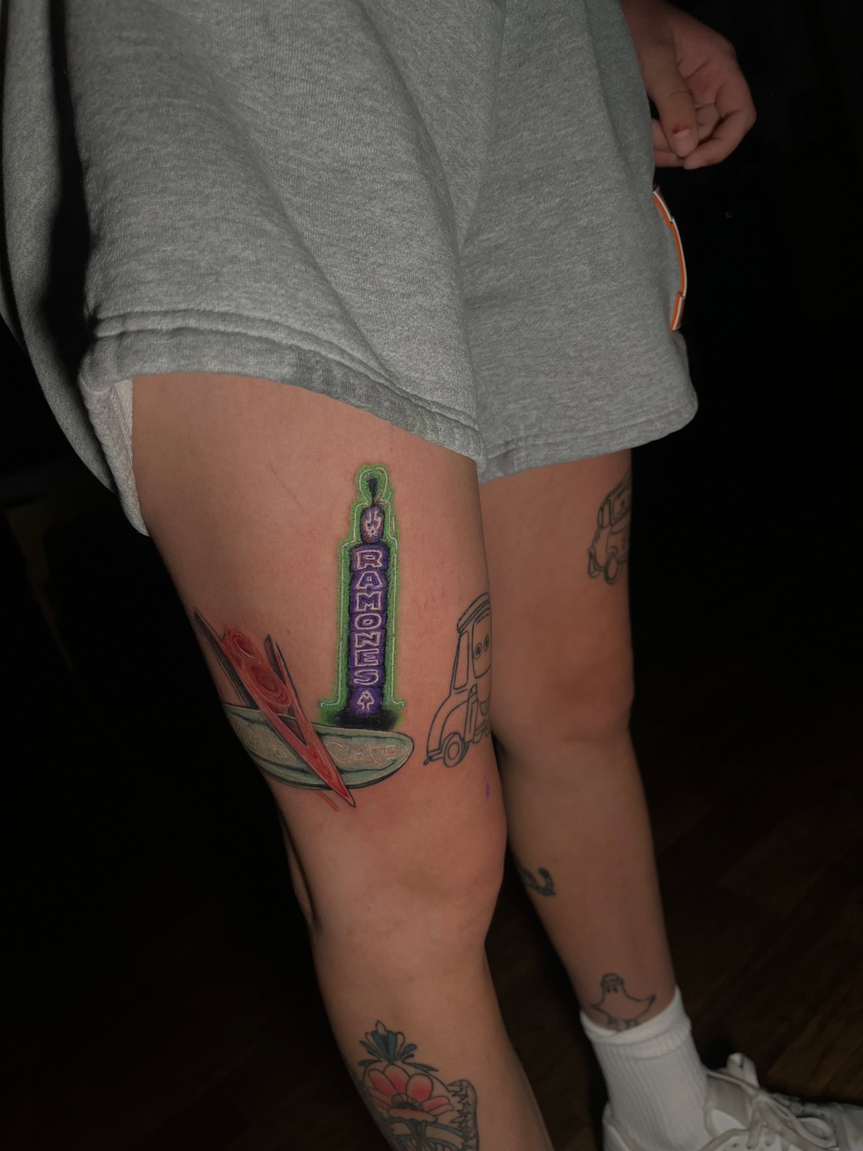 Ramones sign American traditional tattoo on the thigh by Kevin Tron