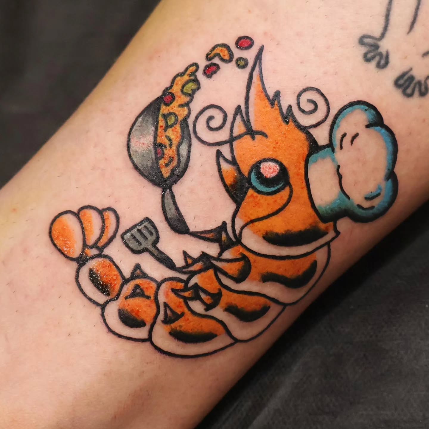 Clownfish American traditional tattoo on the forearm by Chaz Escobar