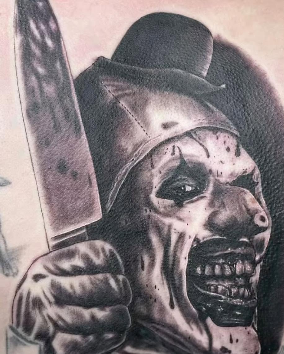 Joker dark realism tattoo on the forearm by Bryon Smith