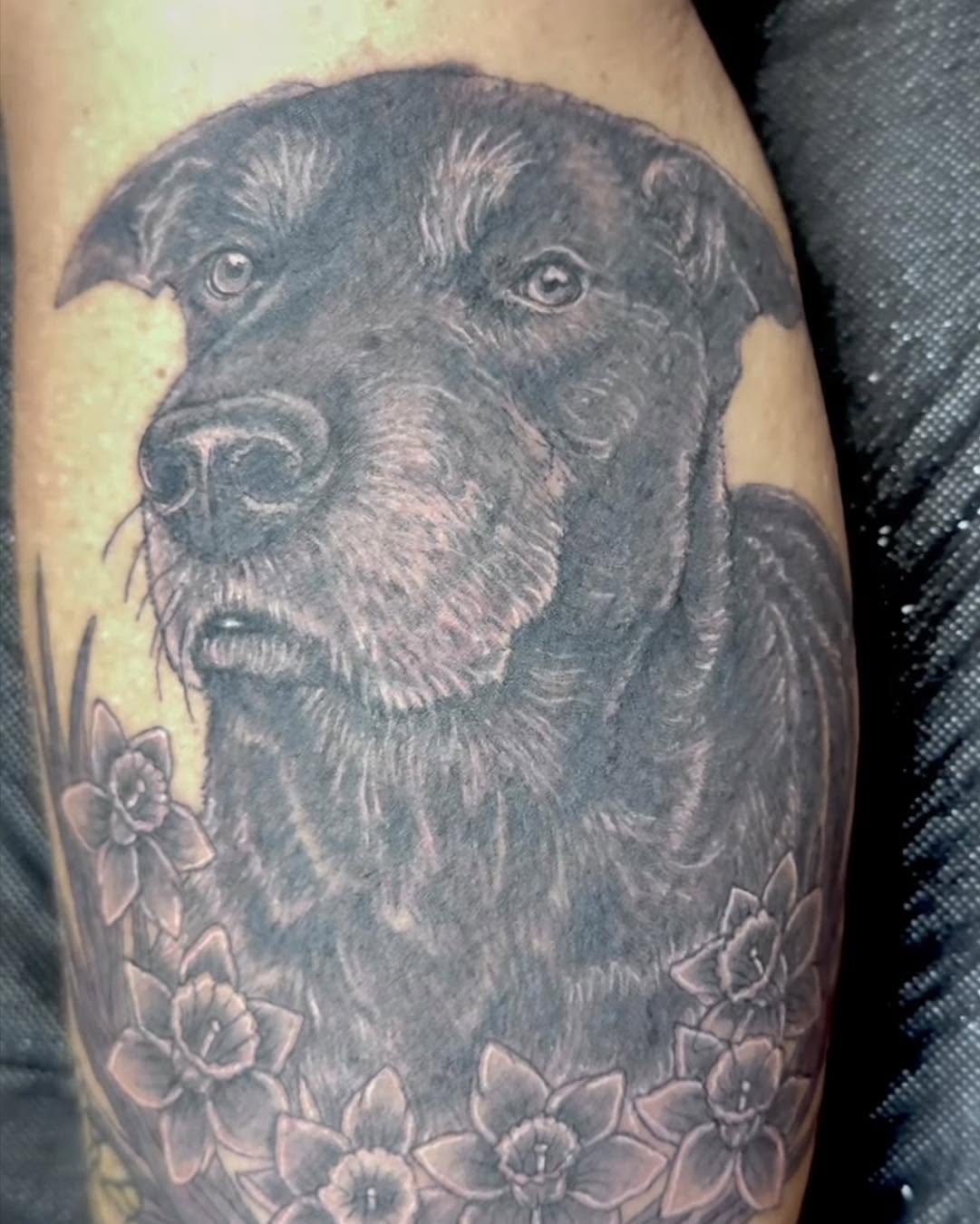 Dog realism tattoo on the forearm by Bryon Smith