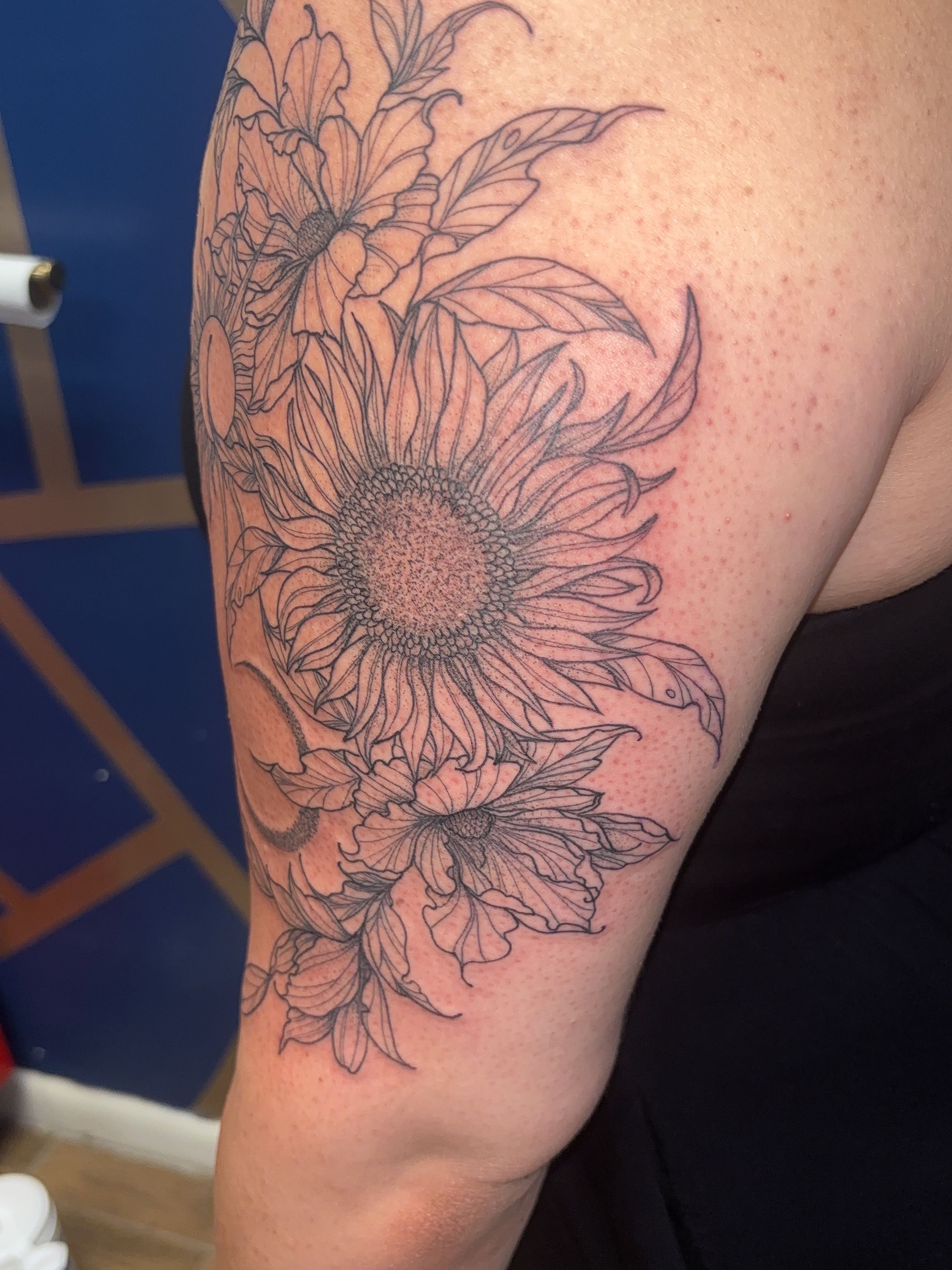 Sunflower black and grey tattoo on the upper arm by ✨Cyerra Lynne✨