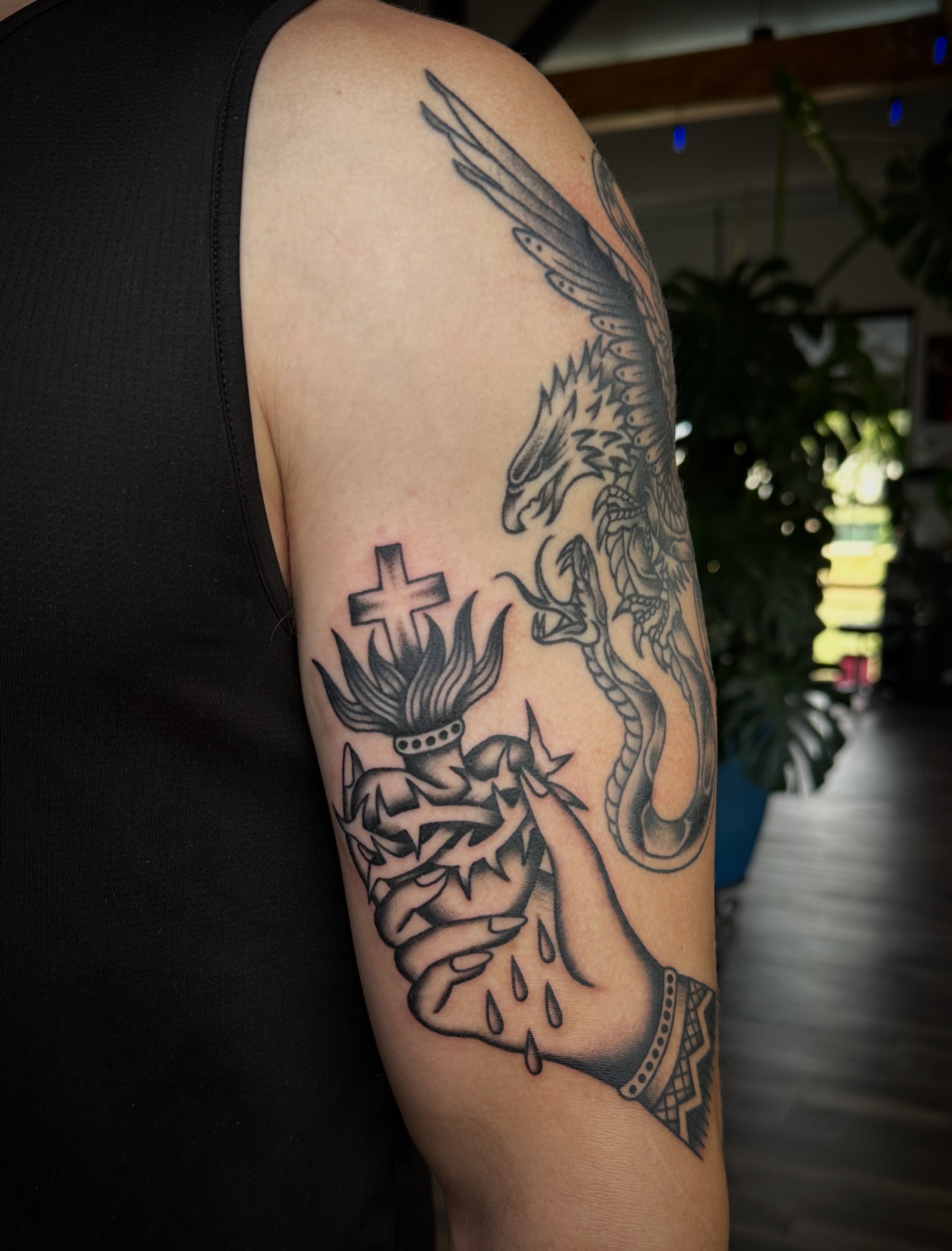 Dragon and flame realism tattoo on the upper arm by Jess Ritchie, Austin, Texas