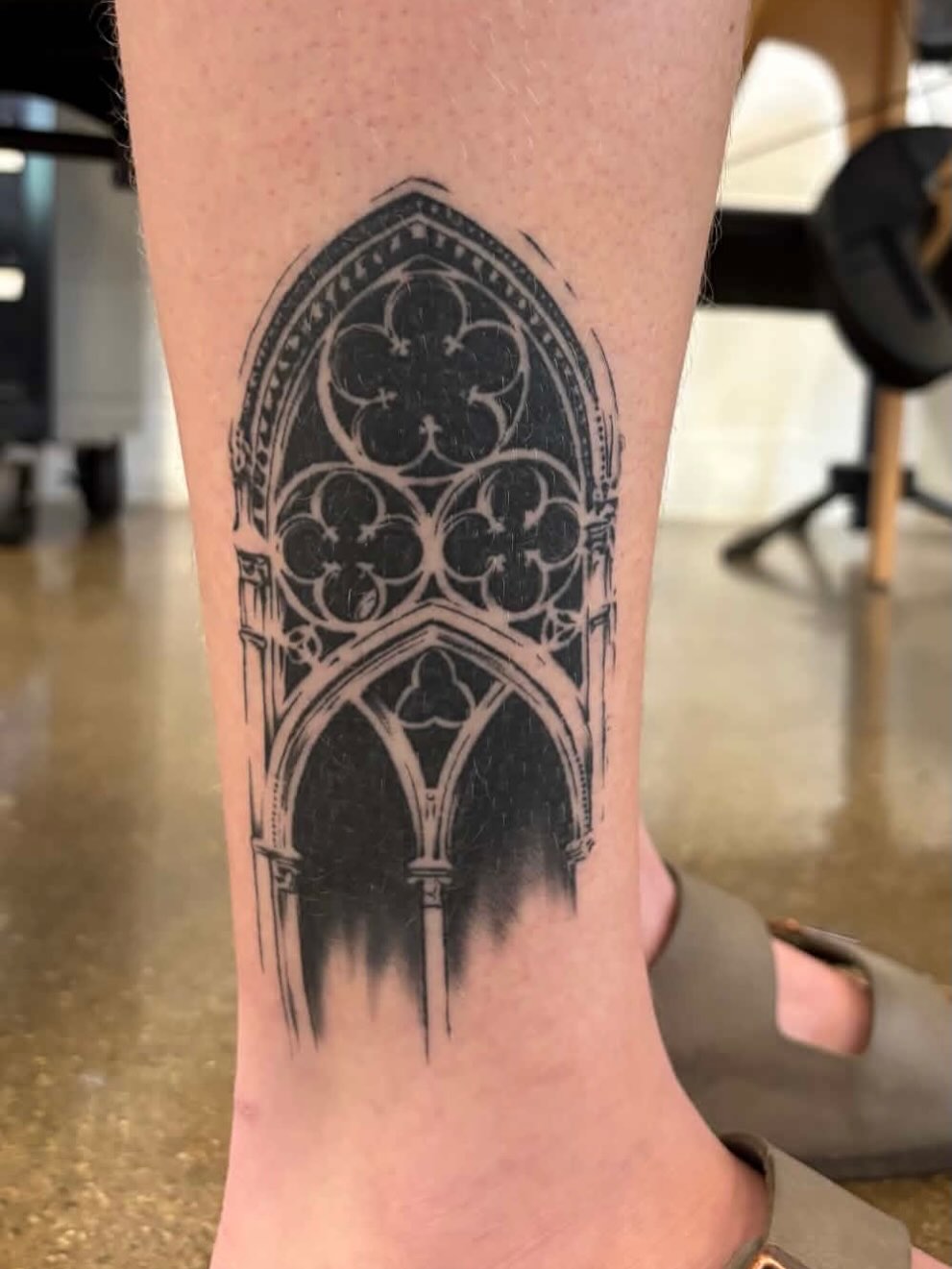 Gothic arch black and grey tattoo on the calf by zoe? tattoo artist¿