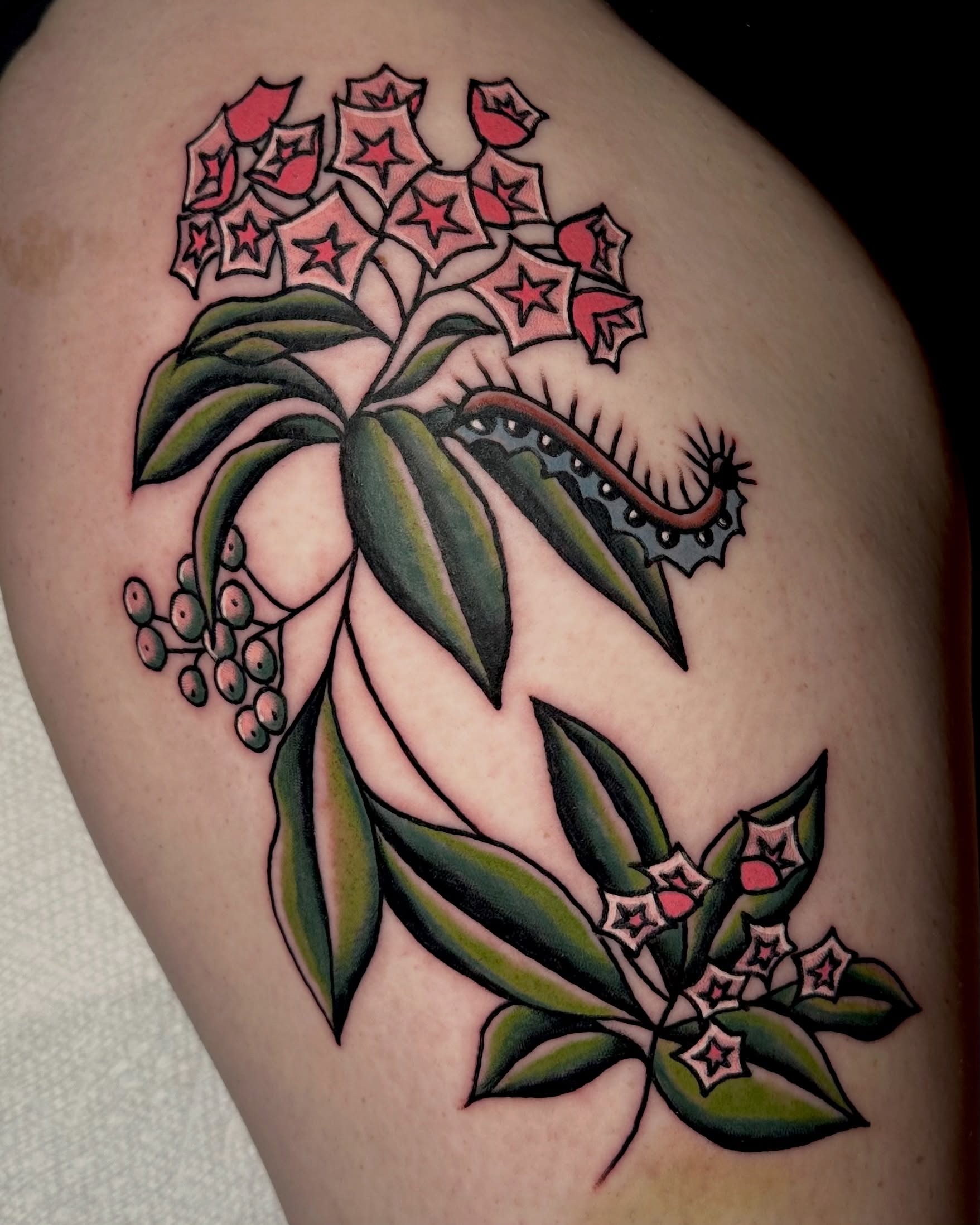 Flower cluster American traditional tattoo on the thigh by rachel knabe