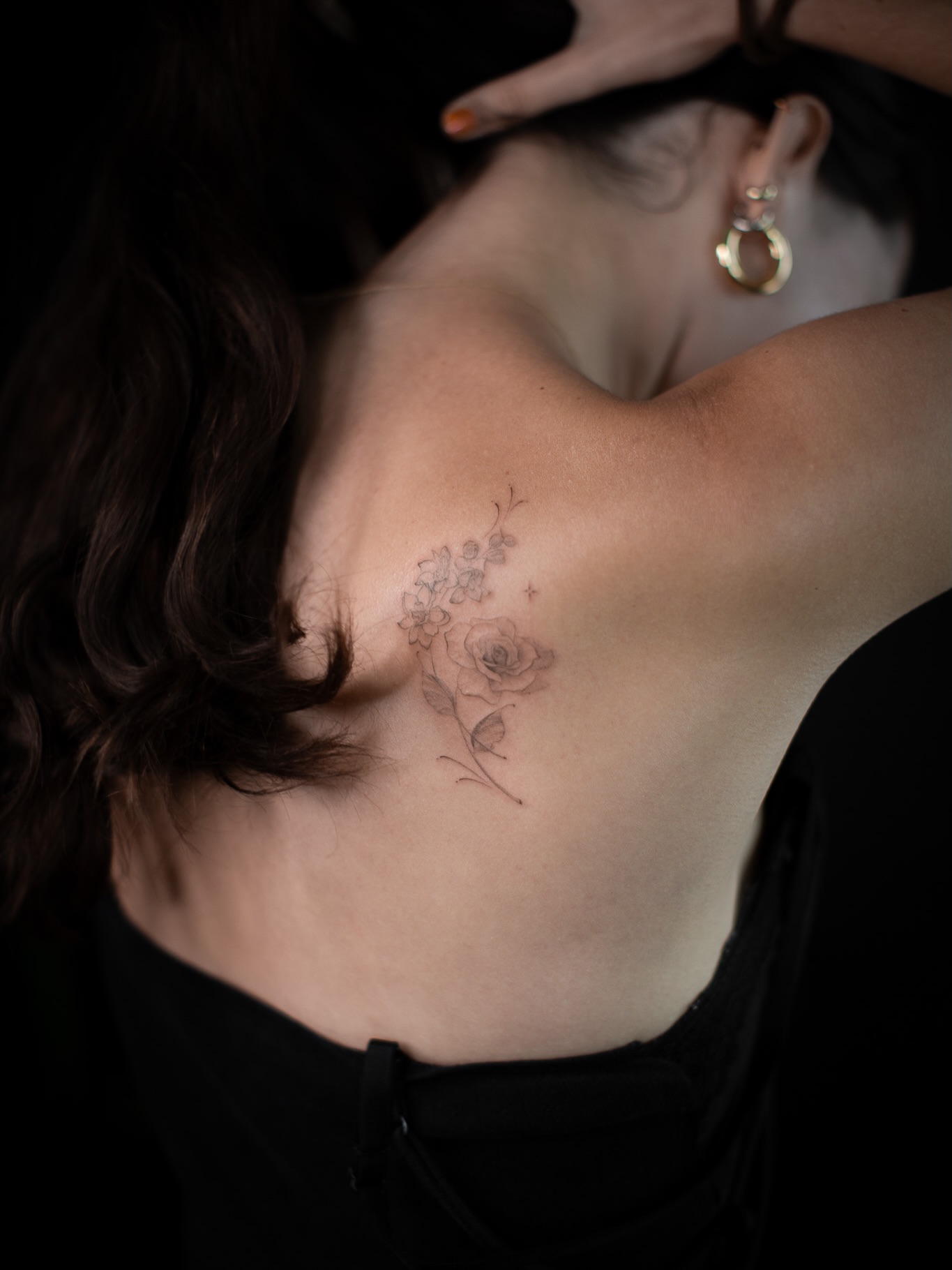 Flowers black and grey tattoo on the shoulder by Aries Rising