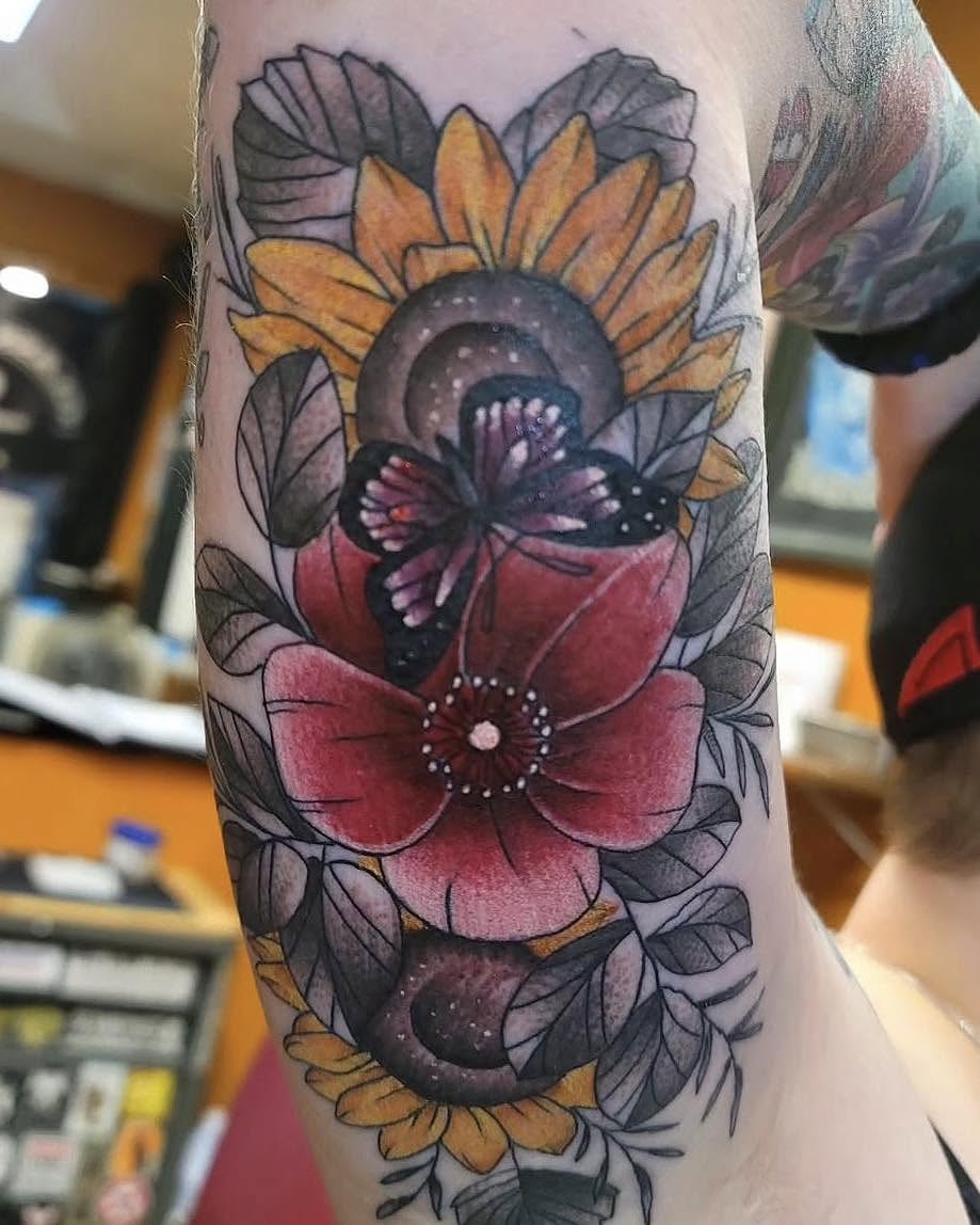 Sunflower and butterfly dotwork tattoo on the forearm by Bryon Smith