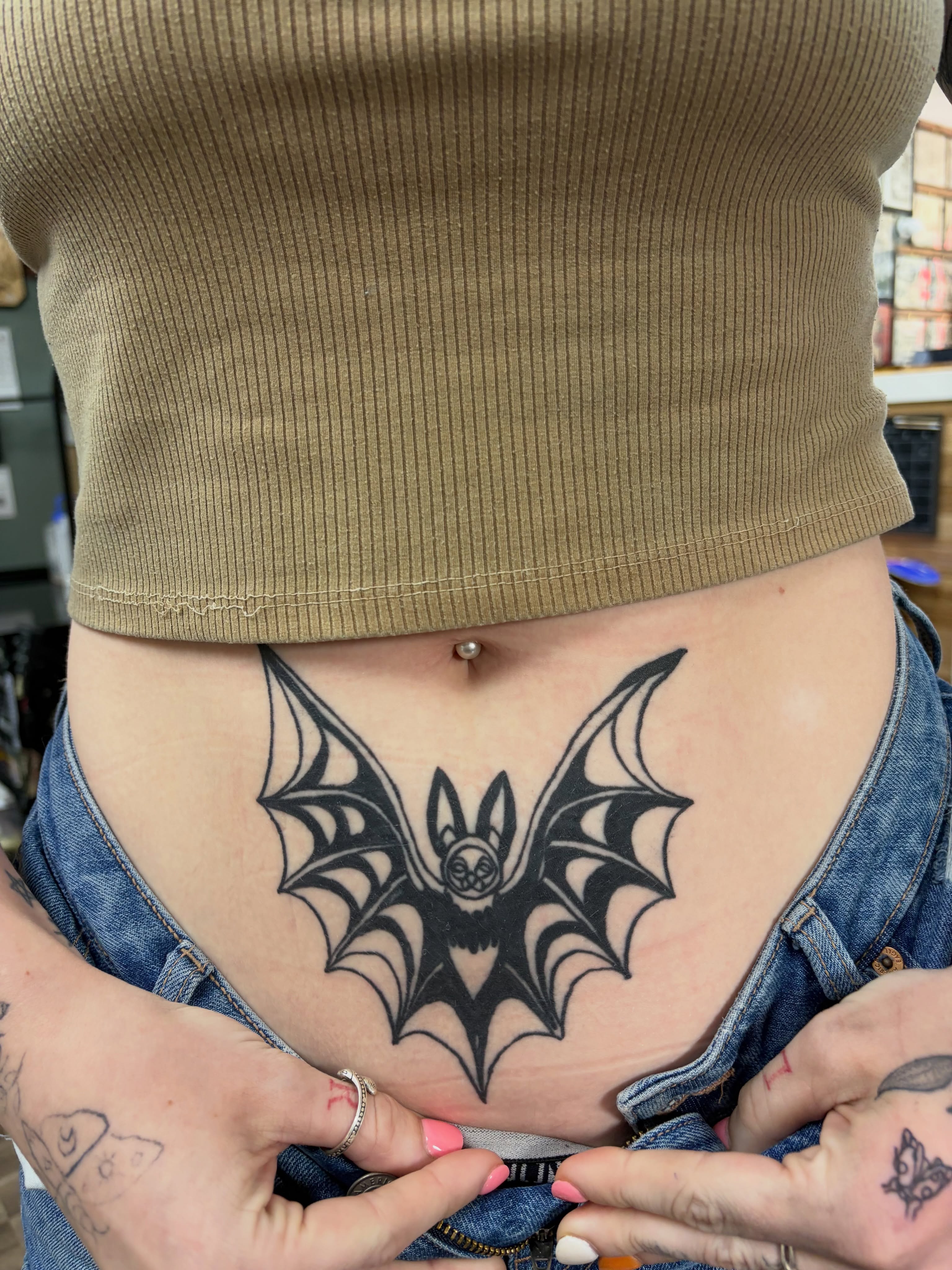 Bat black and grey tattoo on the torso by Michelle