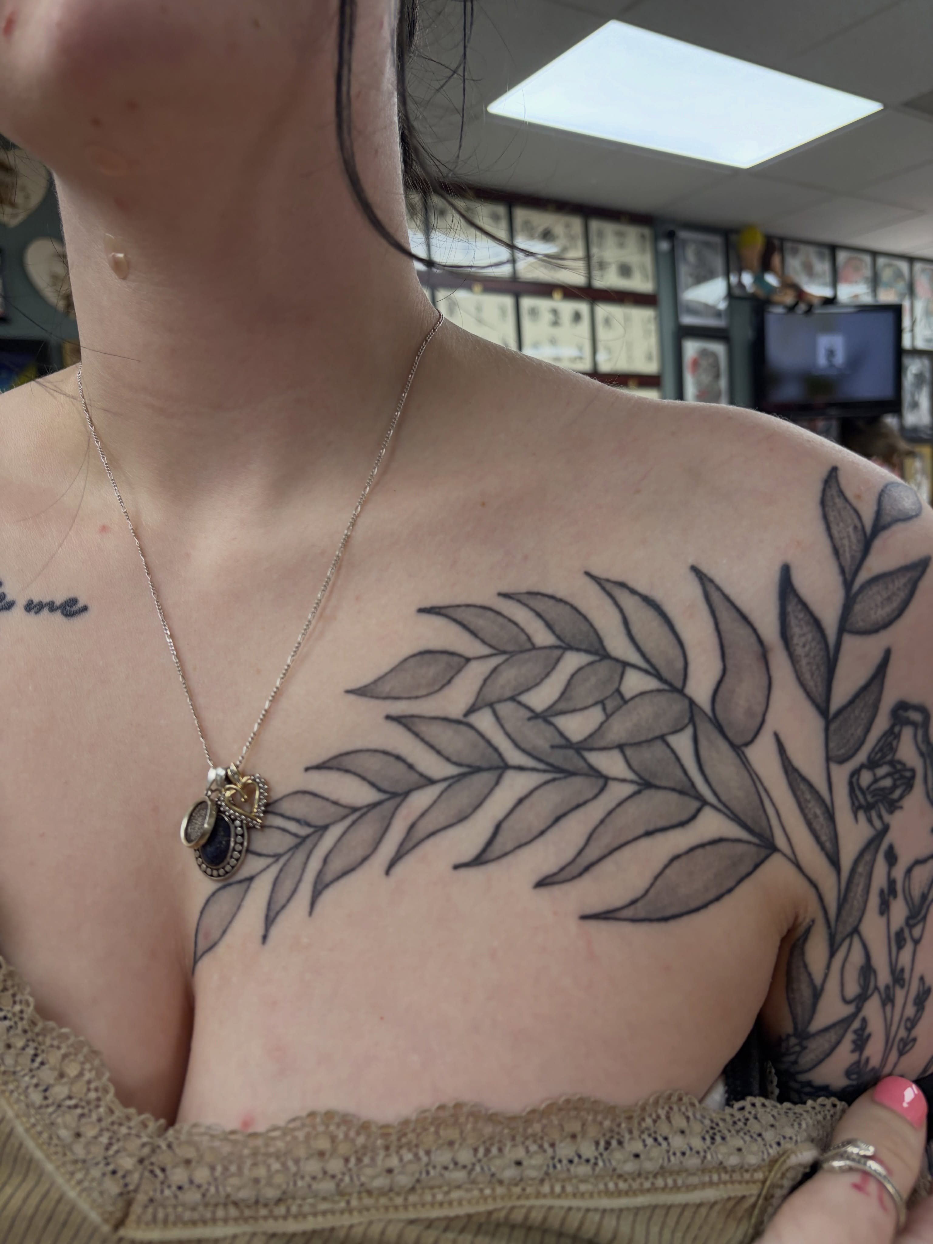 Leaf black and grey tattoo on the chest by Michelle