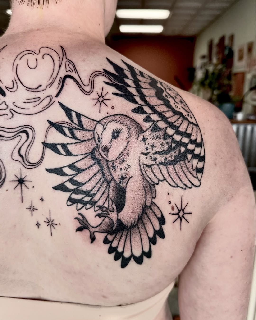 Owl black and grey tattoo on the back by Eden Allen