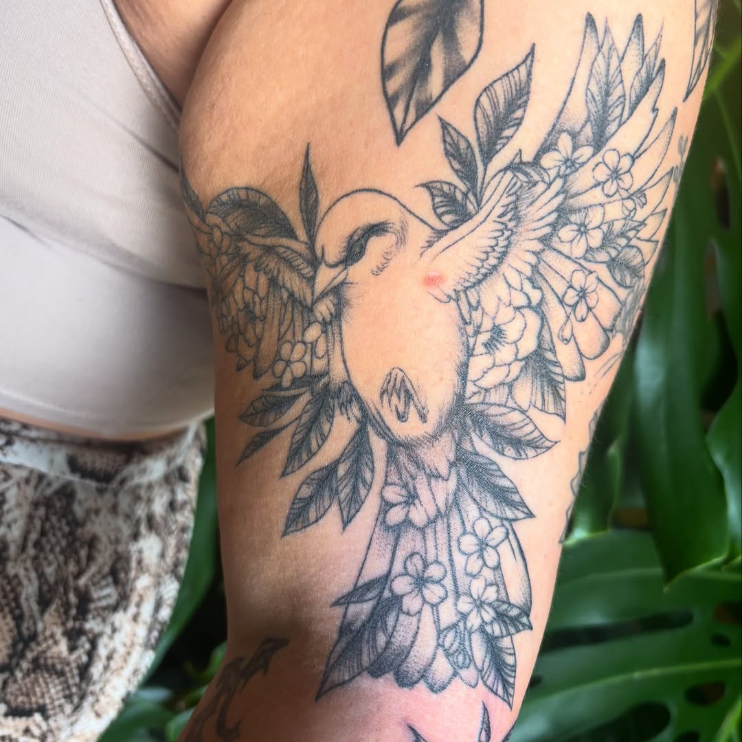 Bird and flowers black and grey tattoo on the forearm by Alex Green, Nashville, Tennessee