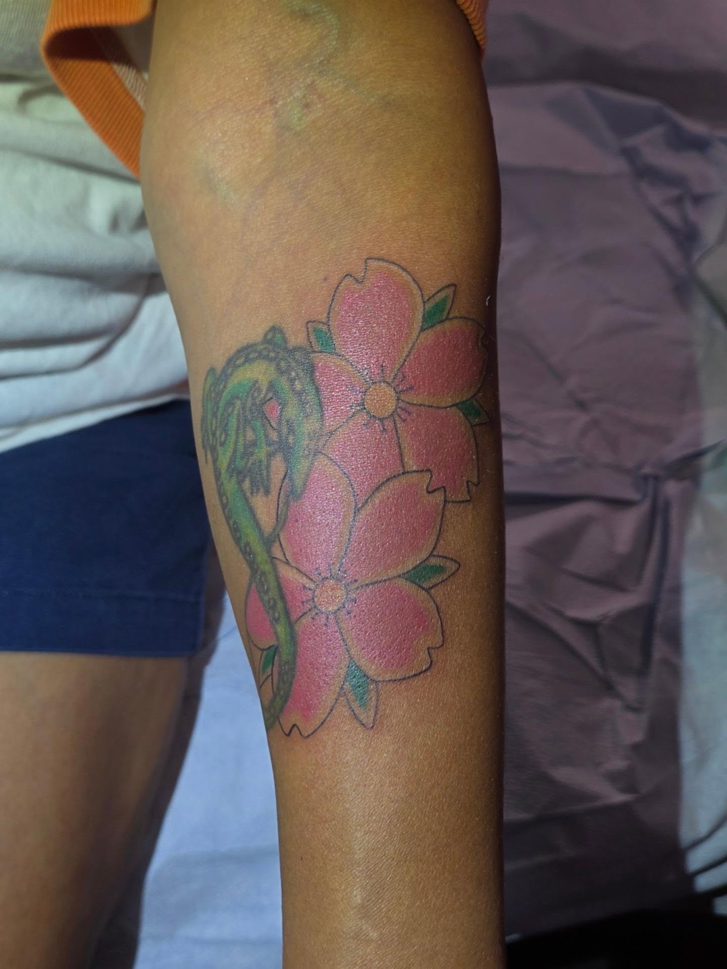 Lotus flowers new school tattoo on the forearm by Jessica Duggan