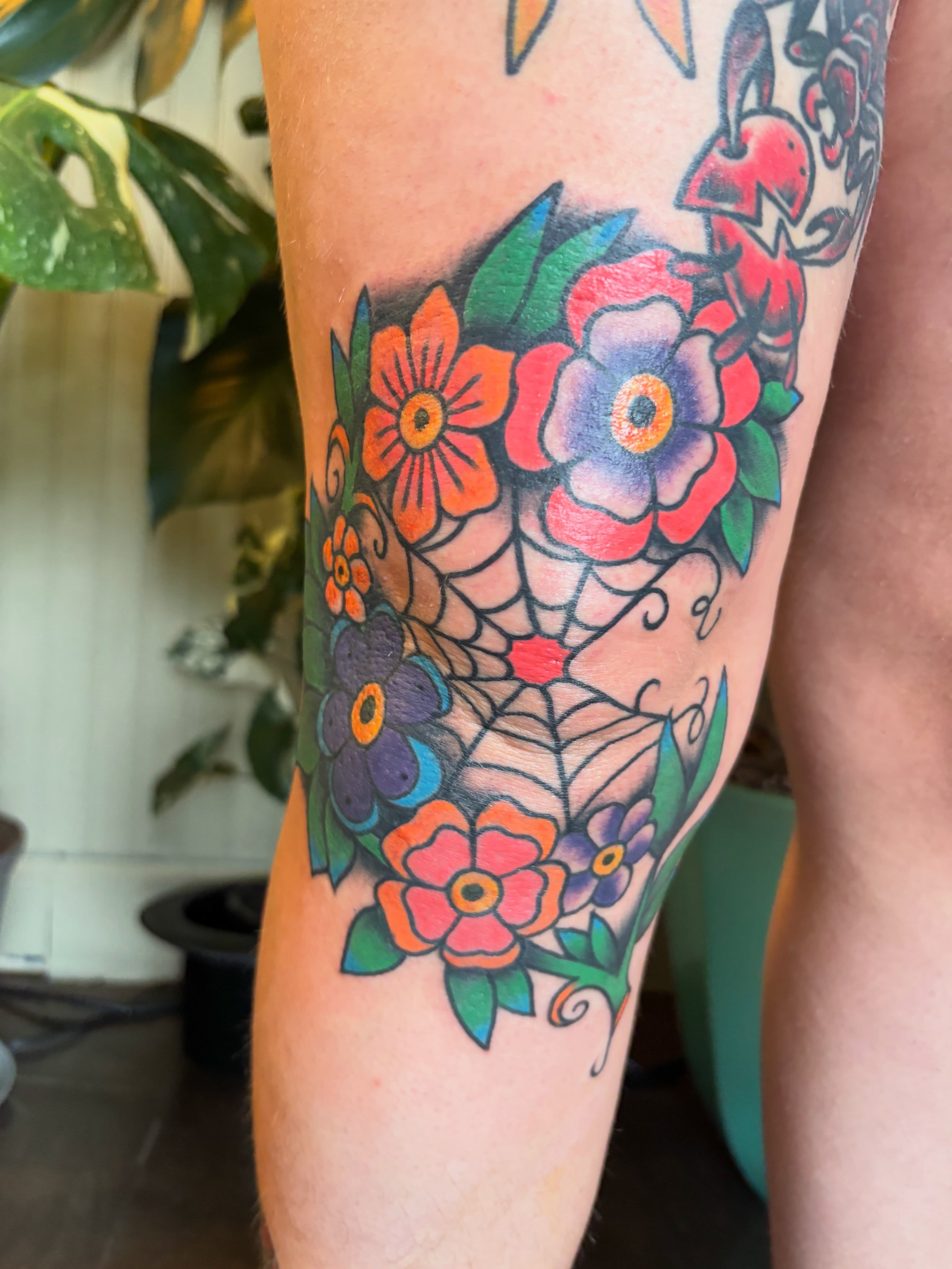 Floral bouquet American traditional tattoo on the forearm by Alex Green, Nashville, Tennessee
