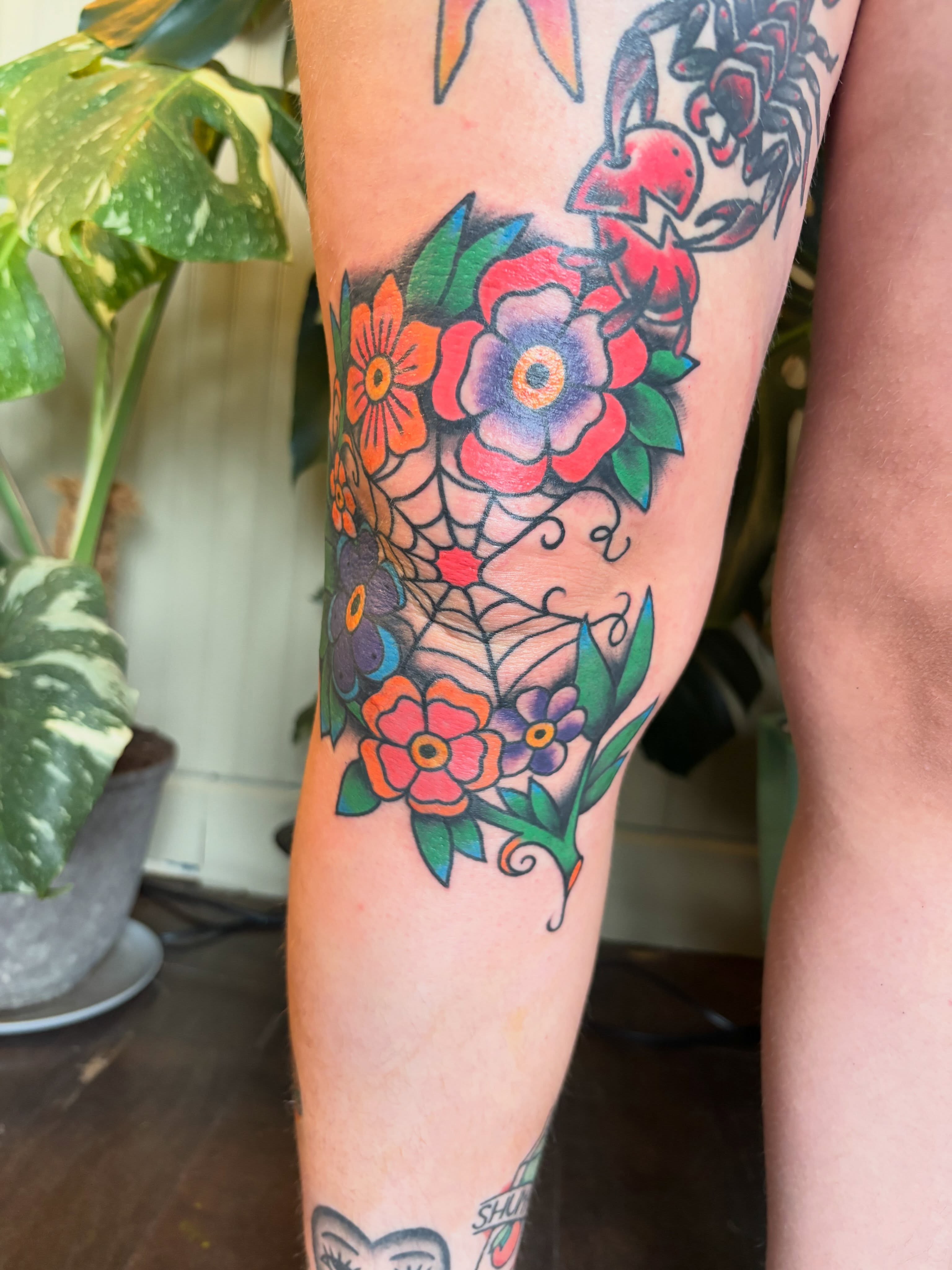 Floral bouquet American traditional tattoo on the forearm by Alex Green, Nashville, Tennessee