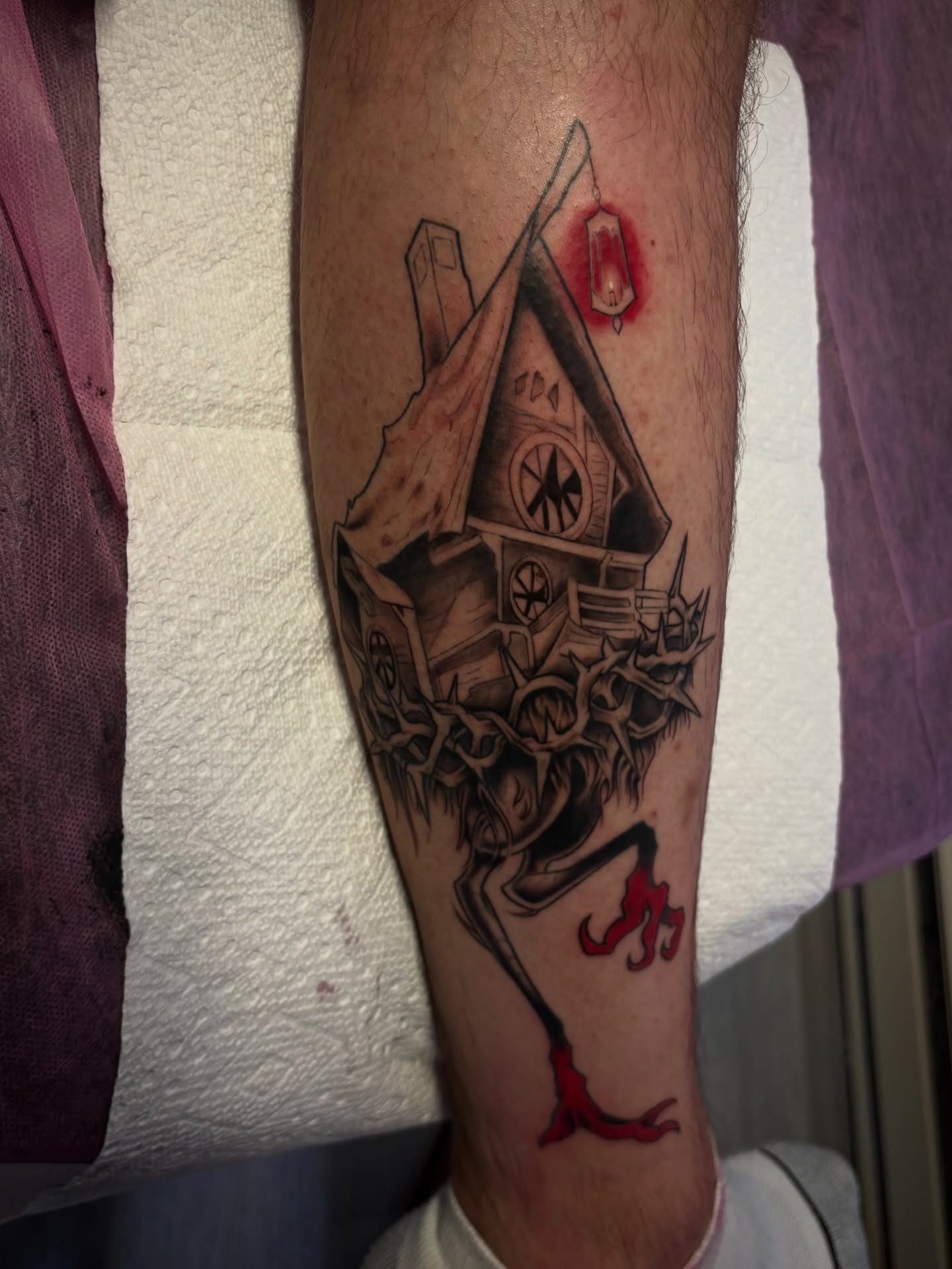 Haunted house dark realism tattoo on the forearm by Elixabeth