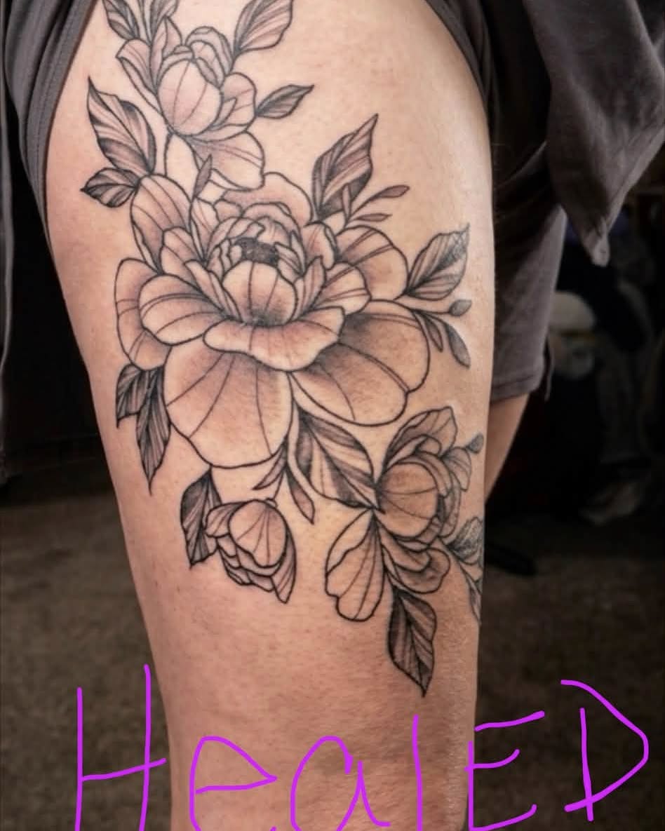 Peony flowers black and grey tattoo on the thigh by Rachel Sellers
