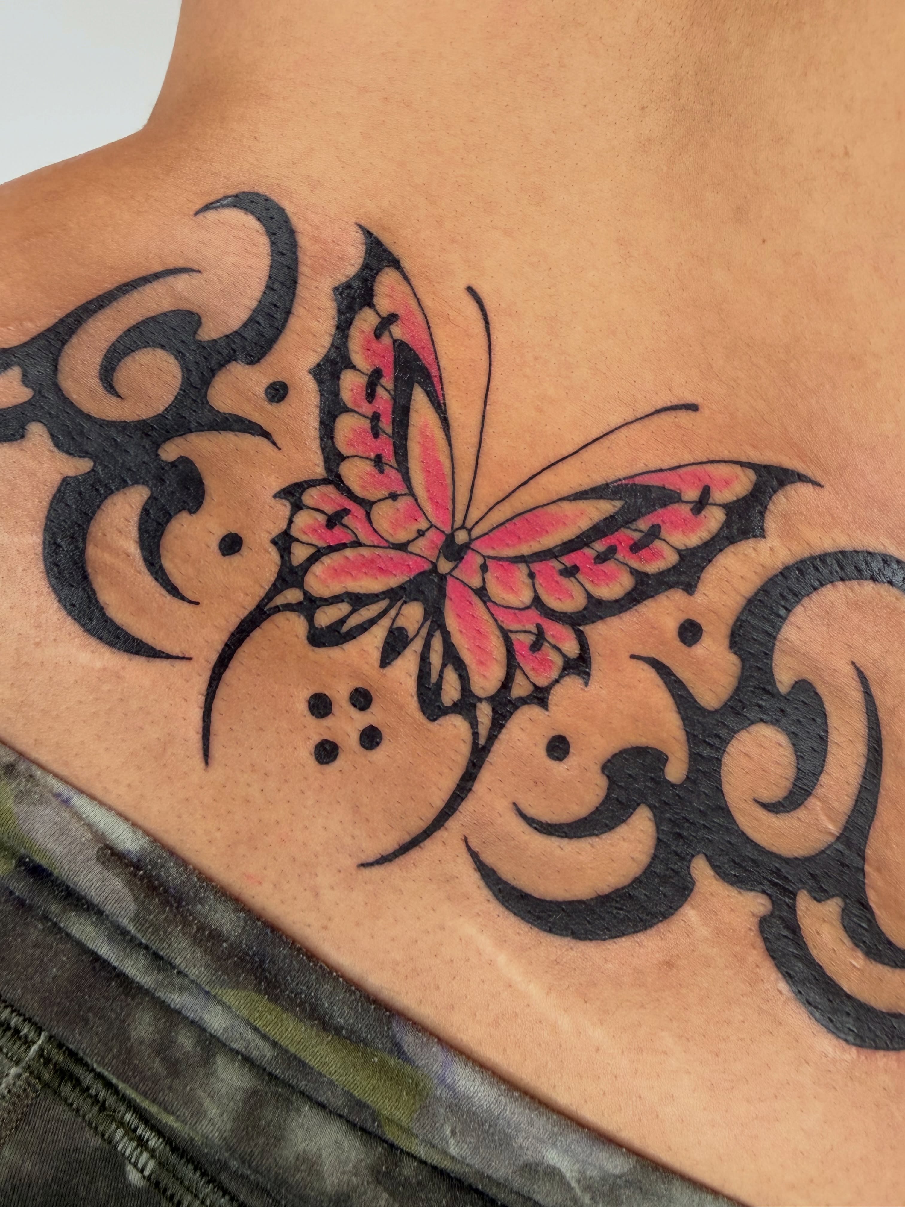 Butterfly tribal tattoo on the back by 𝔓𝔢𝔞𝔠𝔥𝔶 𝔄𝔫𝔰𝔩𝔢𝔶