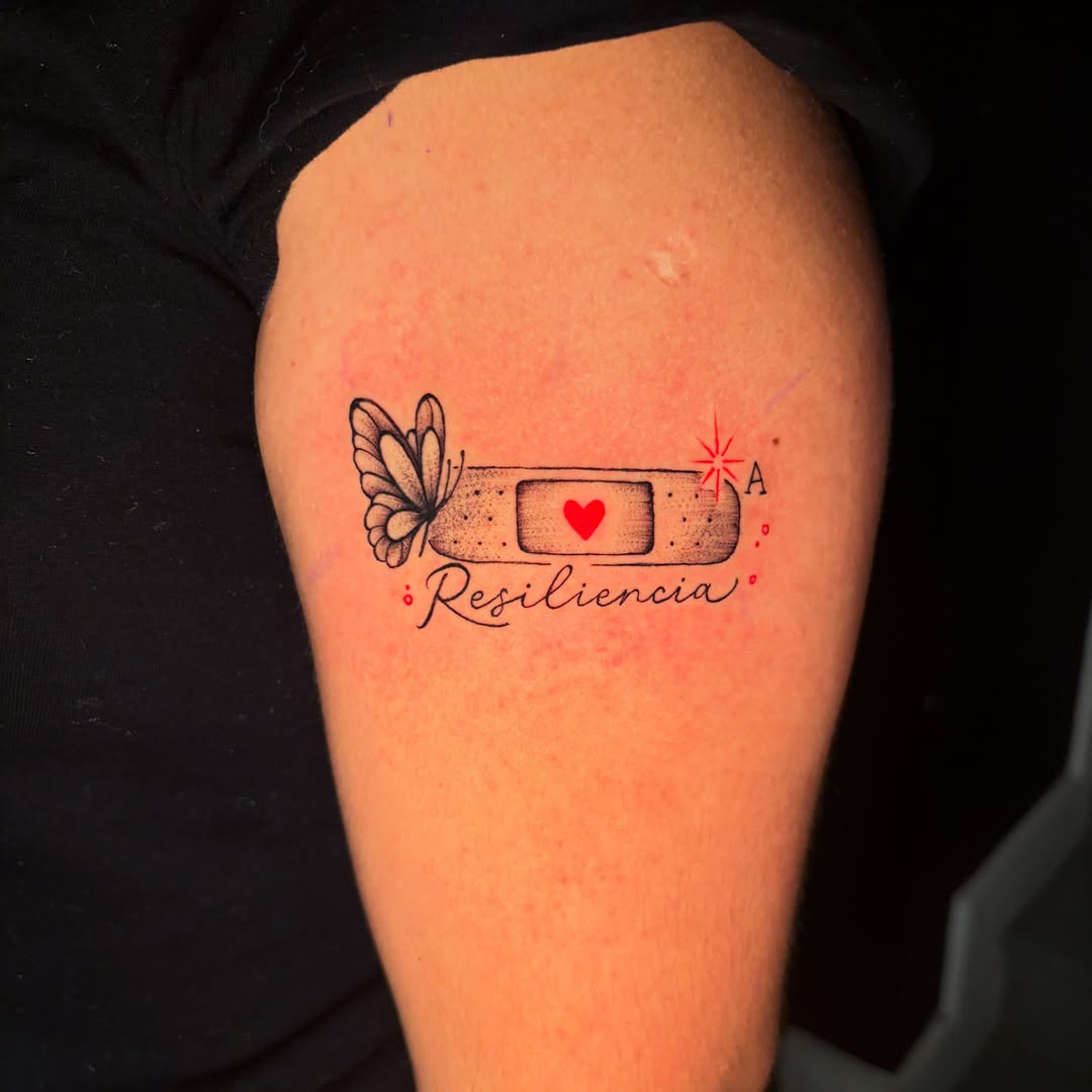 Band aid with butterfly black and grey tattoo on the thigh by @getmoneetattz