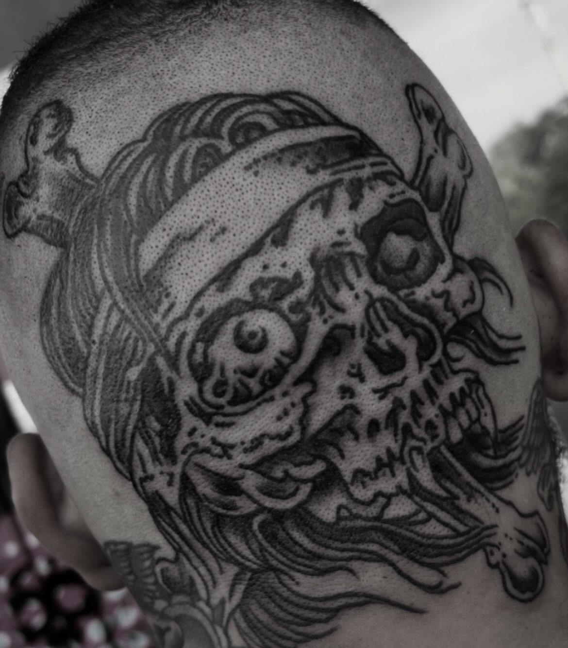 Skull dotwork tattoo on the shoulder by Dylan O'Quin