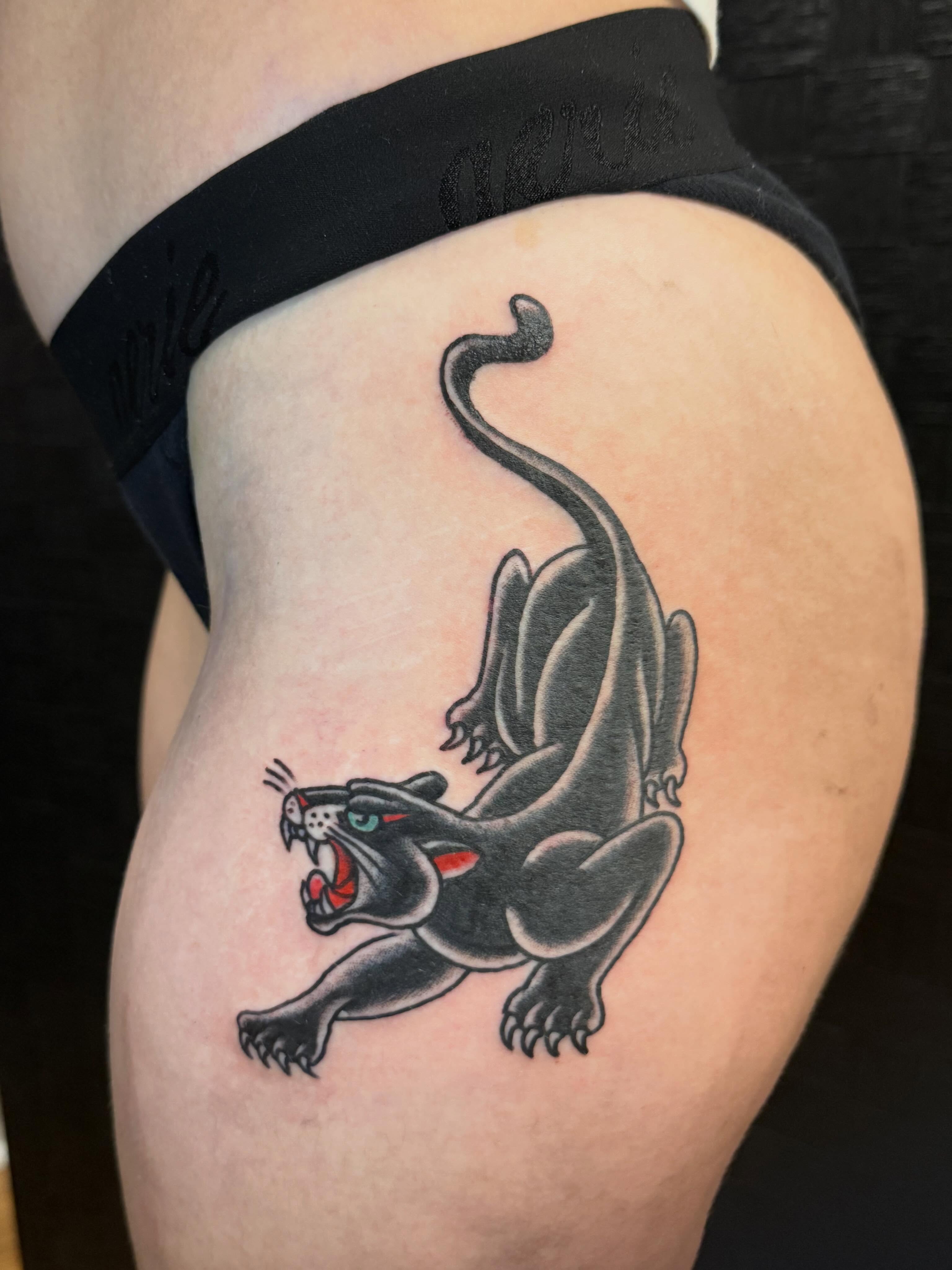 Panther American traditional tattoo on the thigh by Jesse Boss, Nashville, Tennessee