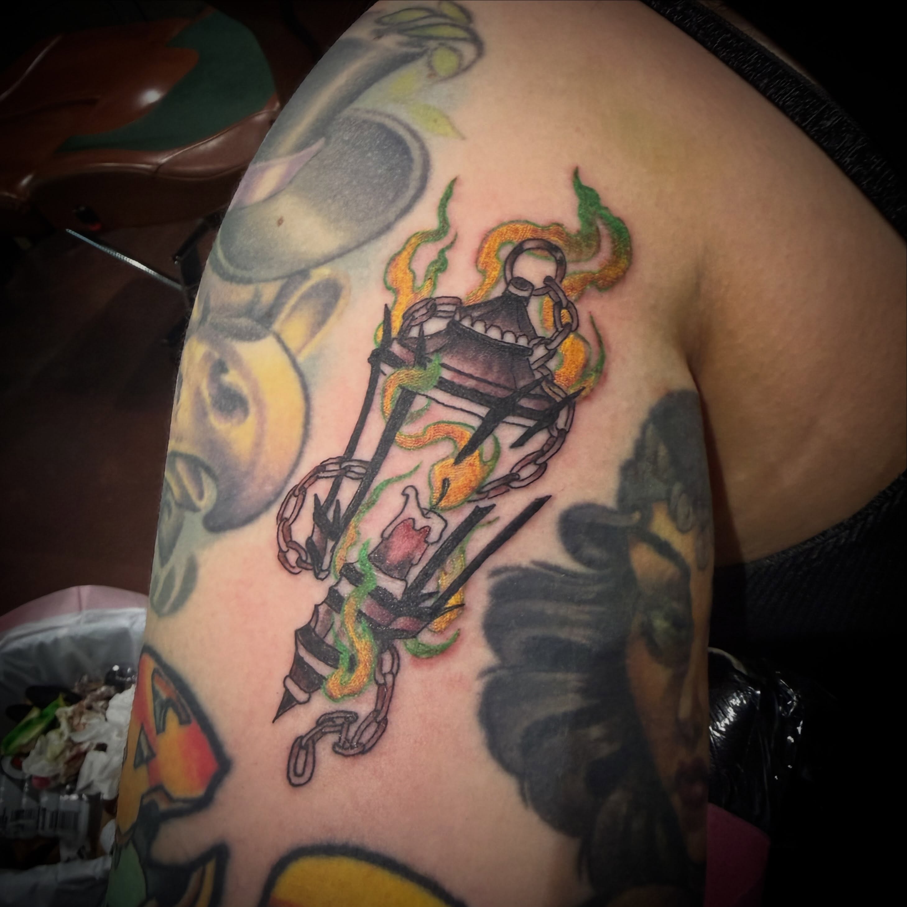 Flame-encased lantern neo-traditional tattoo on the shoulder by Cory Haberman