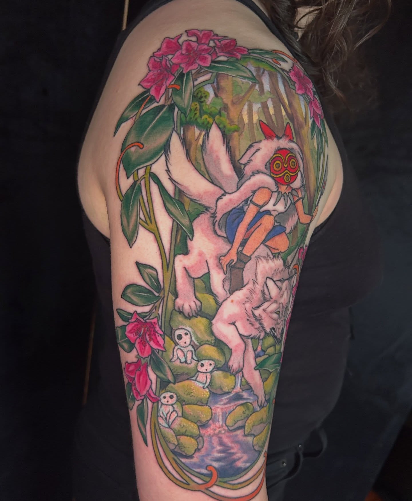 Forest scene anime tattoo on the upper arm by Anna Sylvan Tattoos