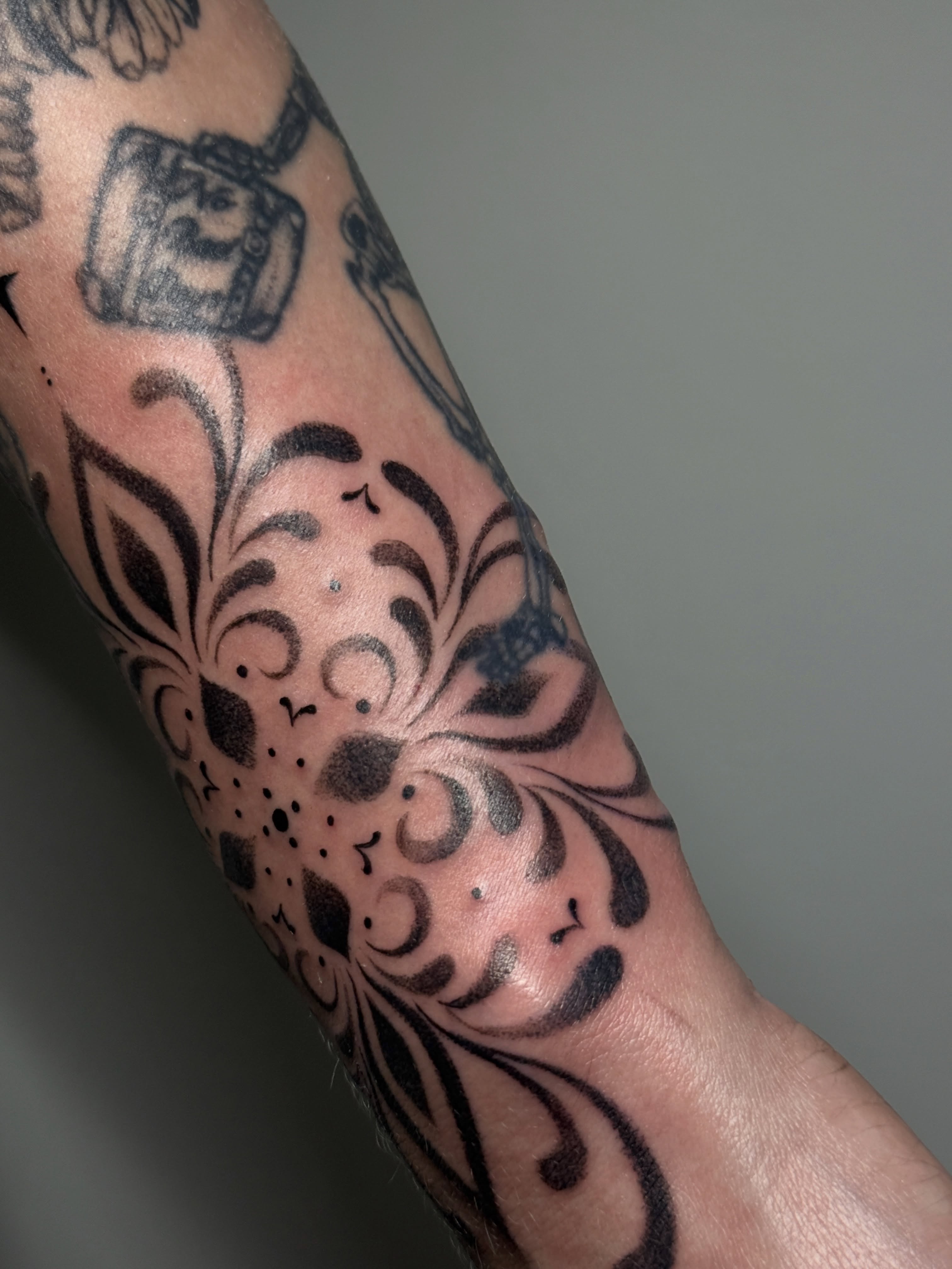 Floral pattern black and grey tattoo on the forearm by 「 ✦ Sa-Na ✦ 」DMV TATTOO ARTIST