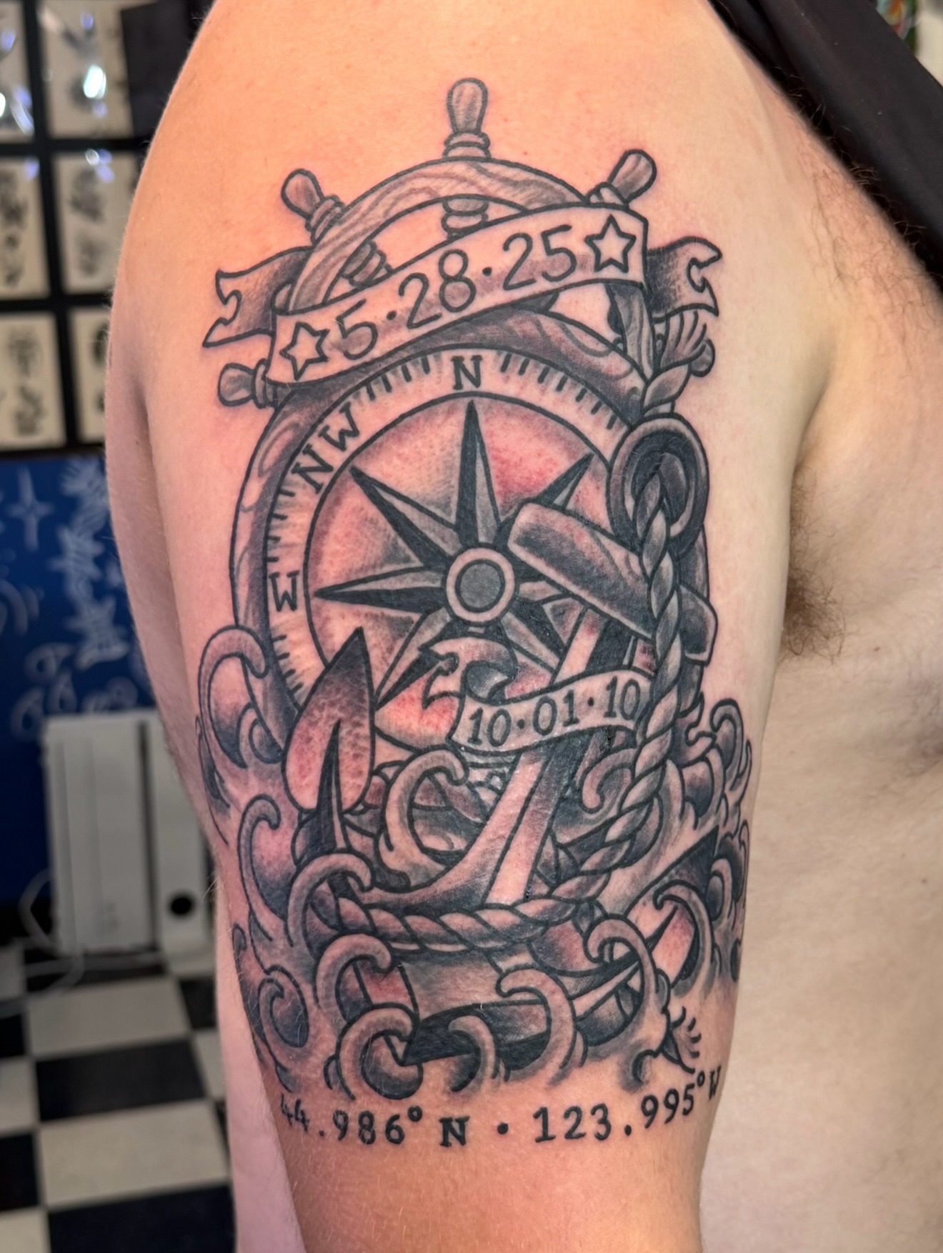 Nautical compass black and grey tattoo on the shoulder by Don Robison