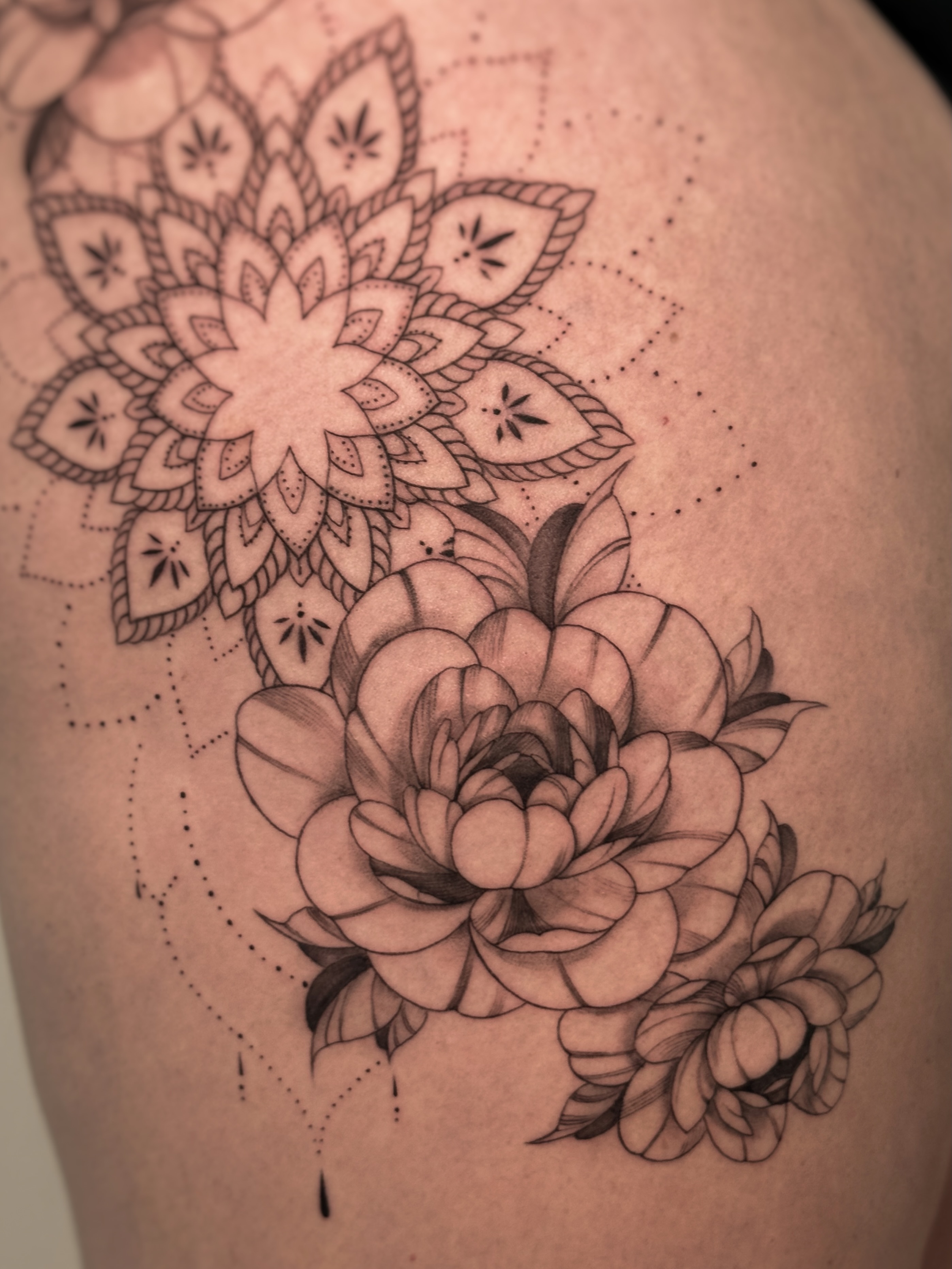 Floral mandala dotwork tattoo on the shoulder by Gianna Rodriguez