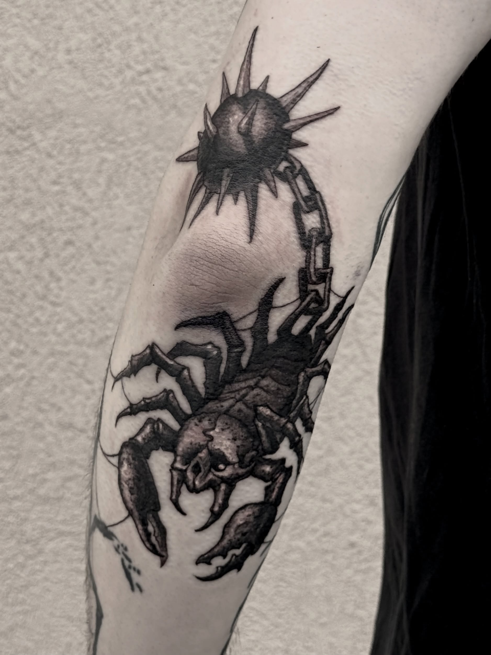 Scorpion black and grey tattoo on the forearm by Jamie