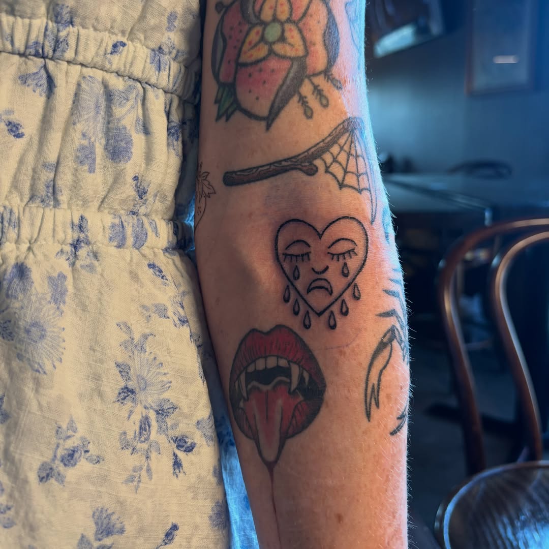 Tears of heart neo-traditional tattoo on the forearm by Rachel