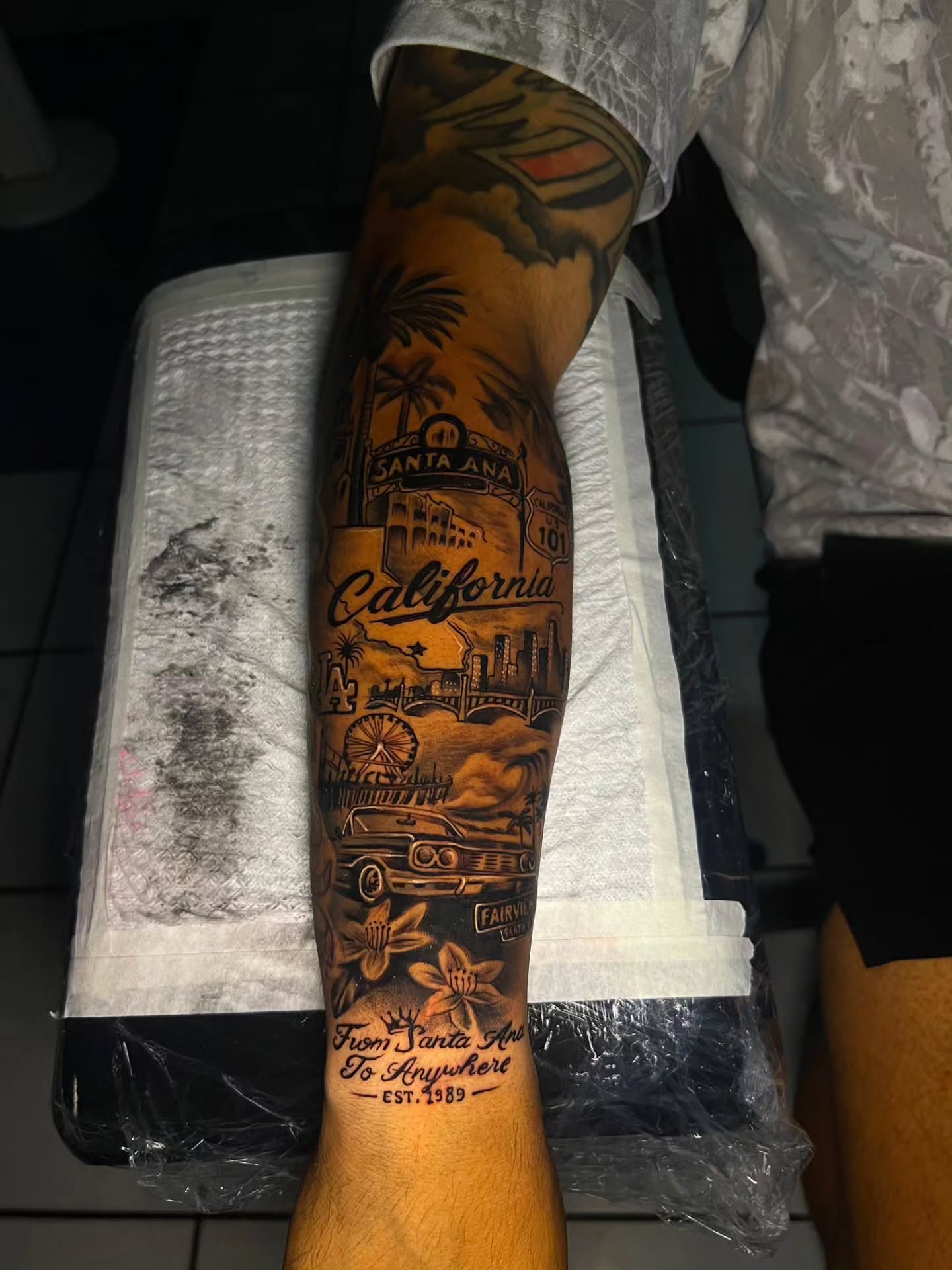 California travel poster American traditional tattoo on the forearm by El Salvador Tattoo Artist