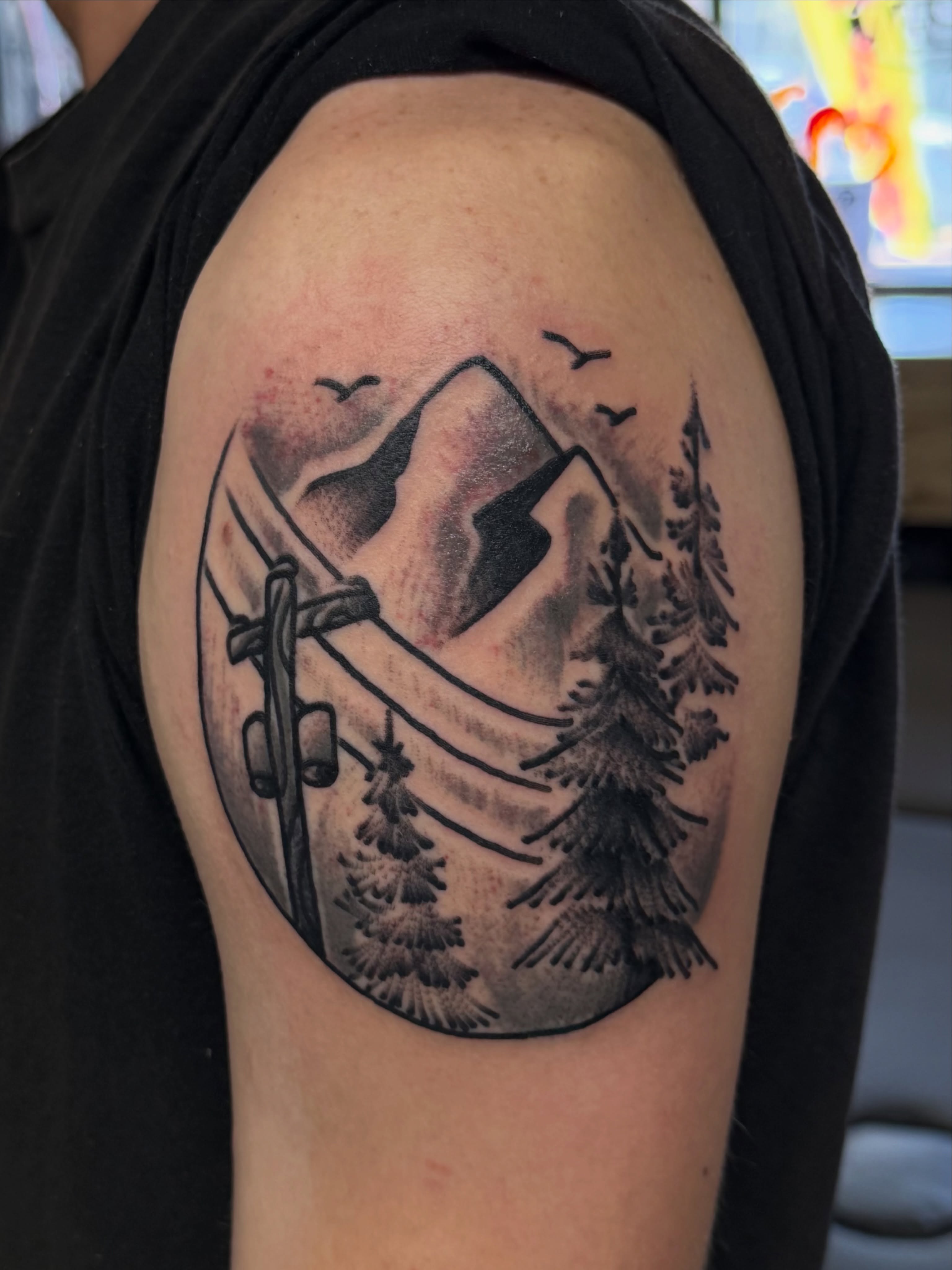 Mountain landscape realism tattoo on the shoulder by Don Robison