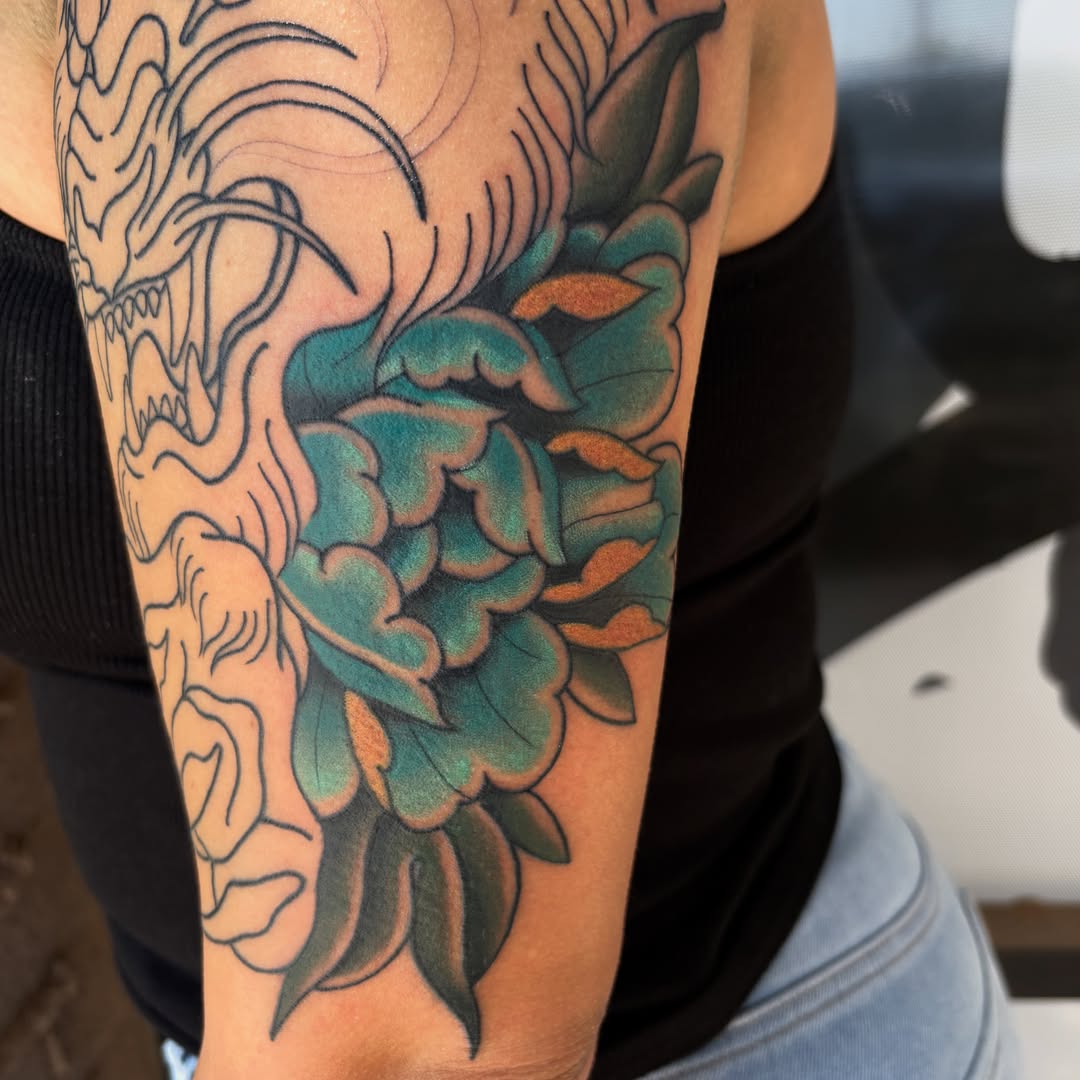 Peony and dragon American traditional tattoo on the forearm by Allyson Monique