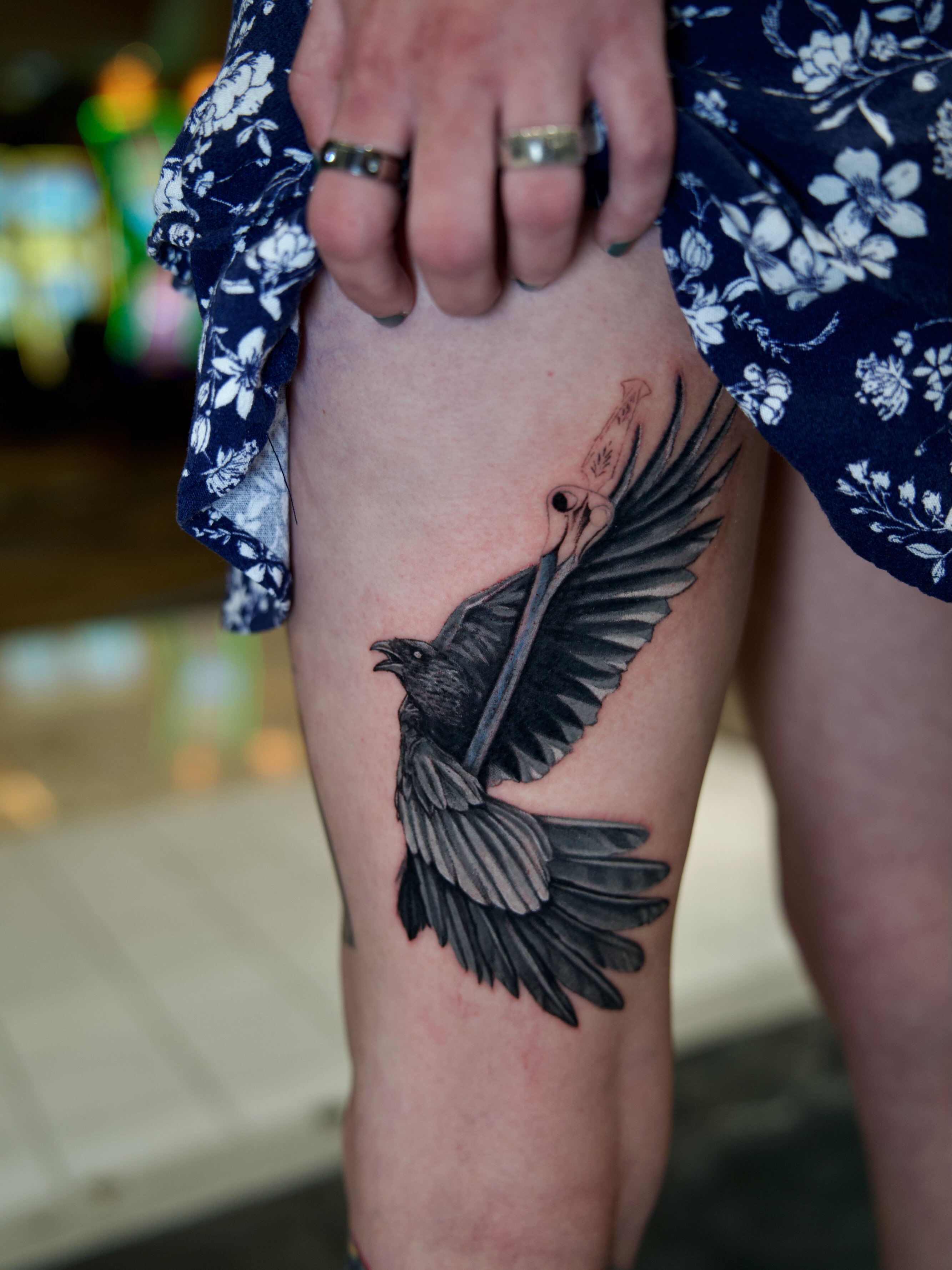 Crow realism tattoo on the thigh by Raven Wood