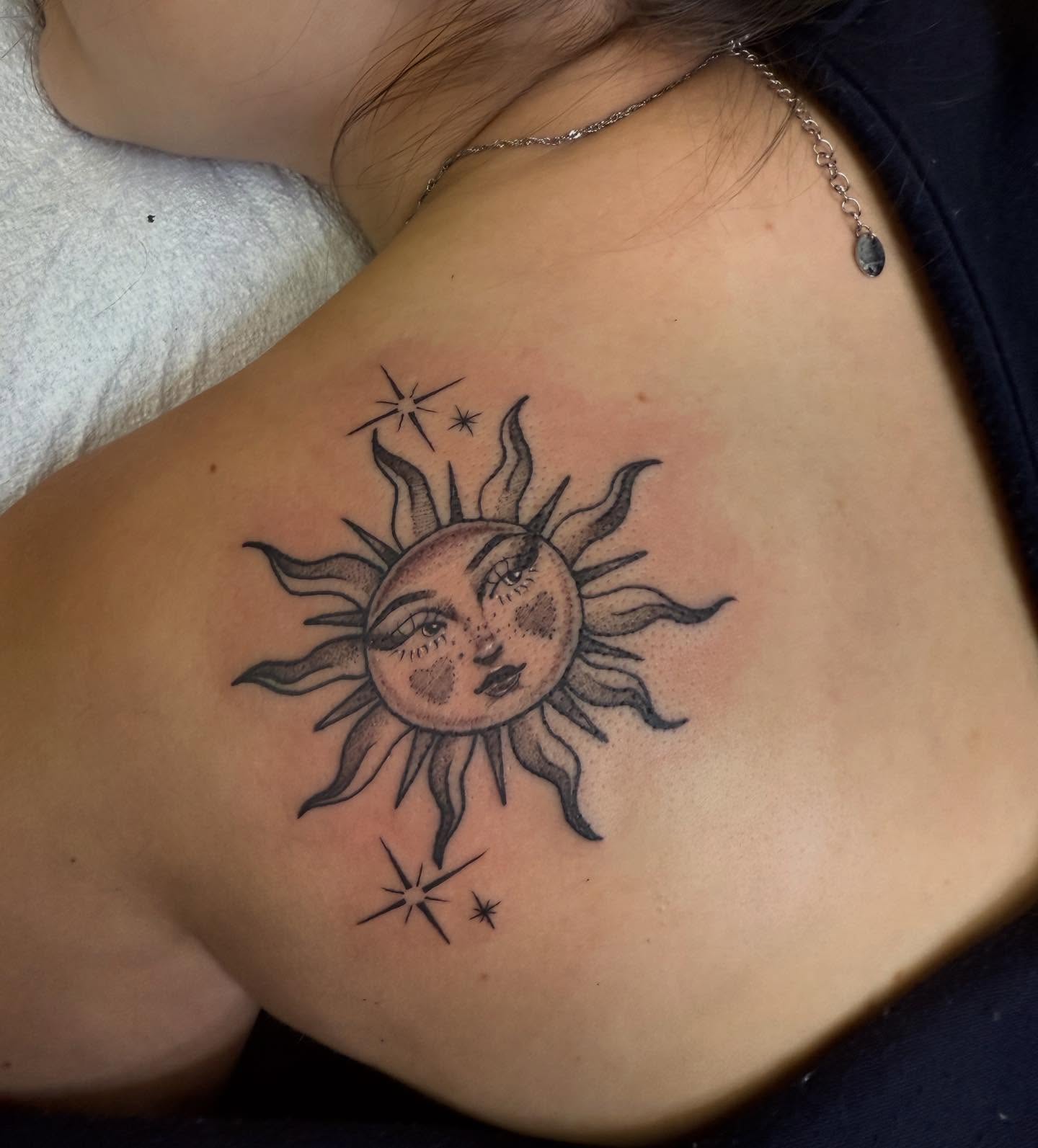 Sun black and grey tattoo on the shoulder by Jacie Aasen-Lupino