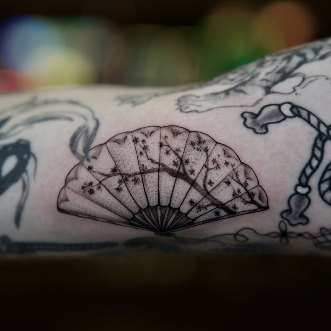 Cherry blossom fan dotwork tattoo on the forearm by Raven Wood
