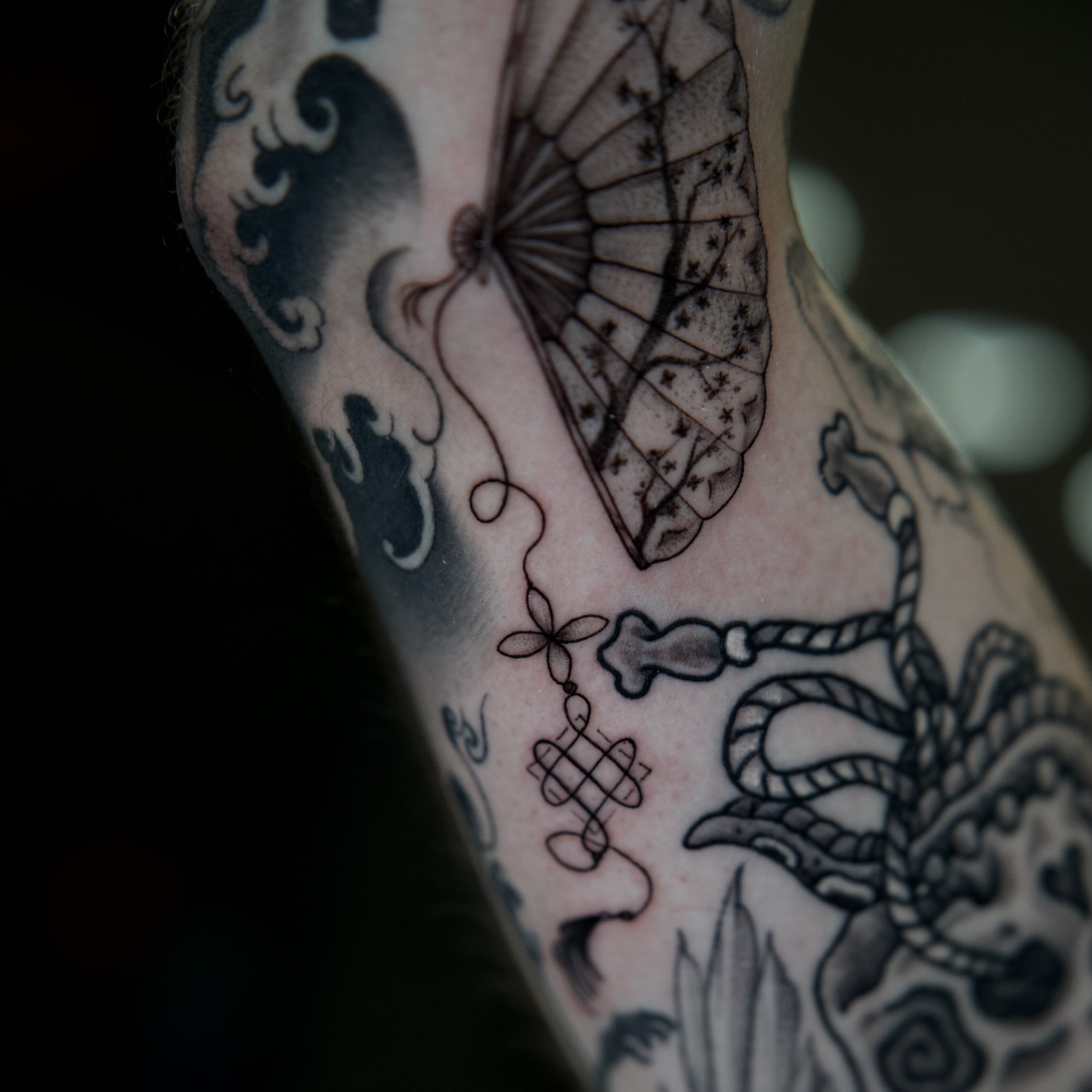 Insect and leaf black and grey tattoo on the forearm by Raven Wood