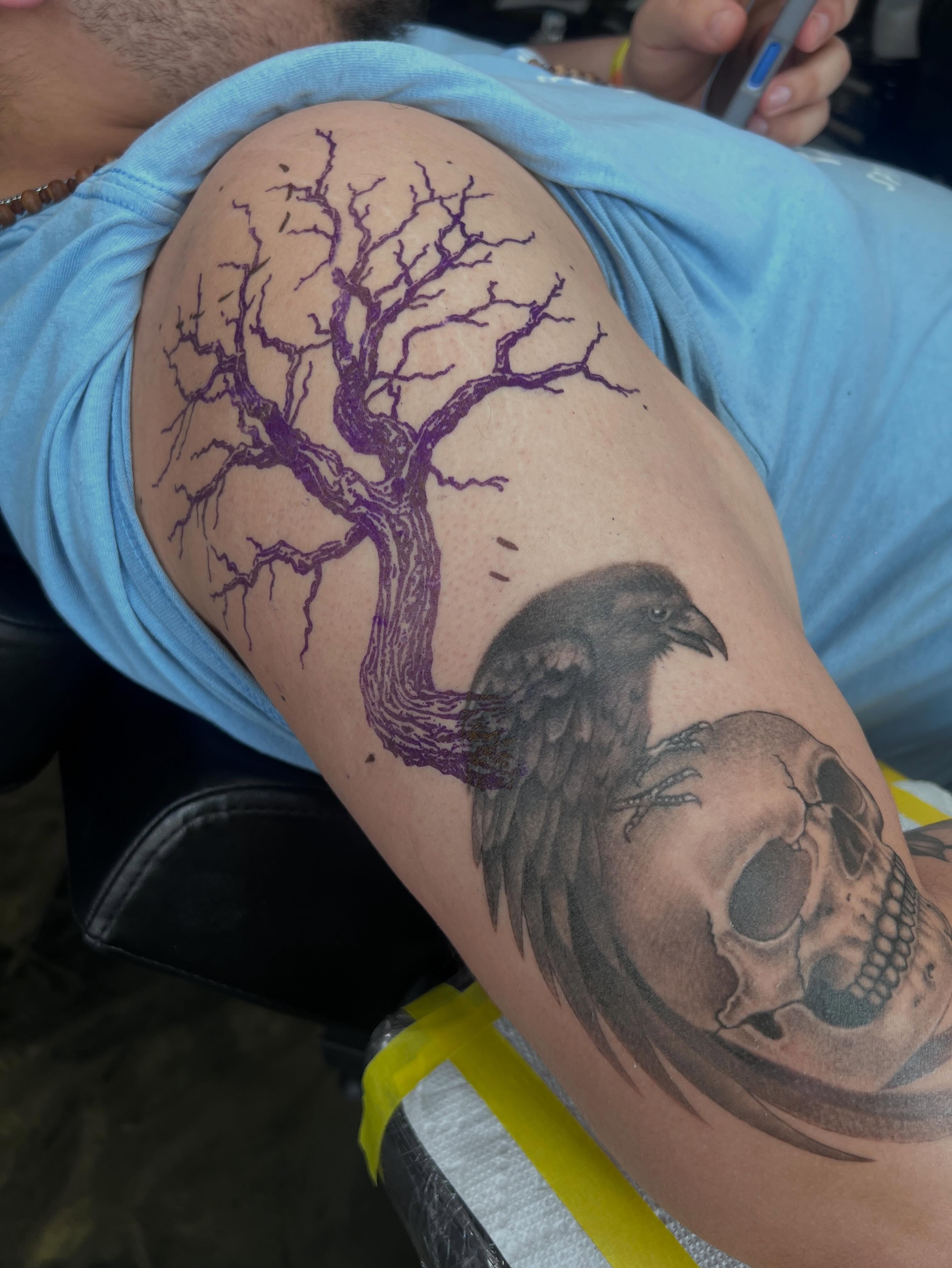 Raven on skull with tree tattoo on the thigh by Gerardo Galicia, New York, New York