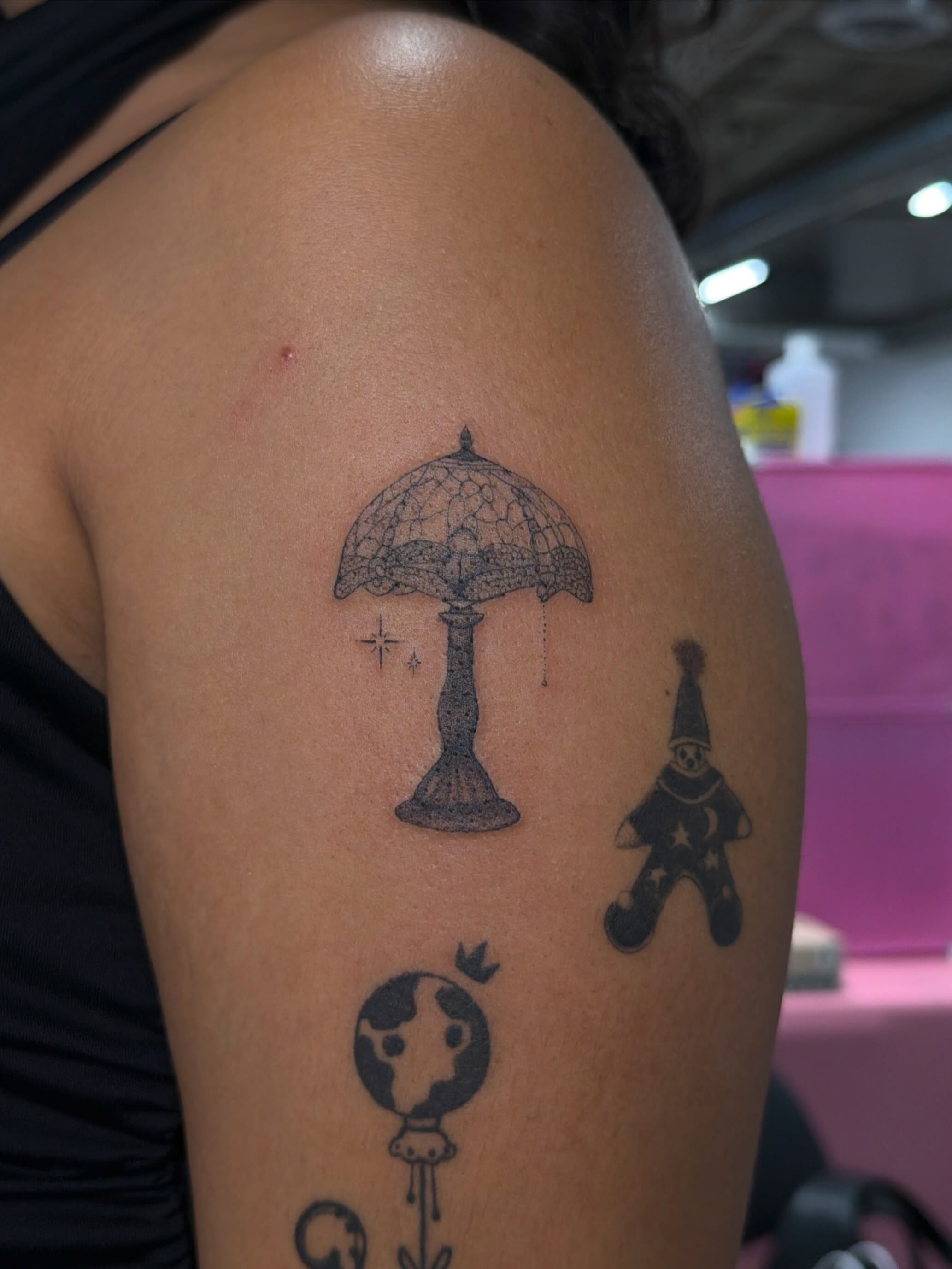 Lamp and gnome black and grey tattoo on the shoulder by Sienna (jj) Hicks