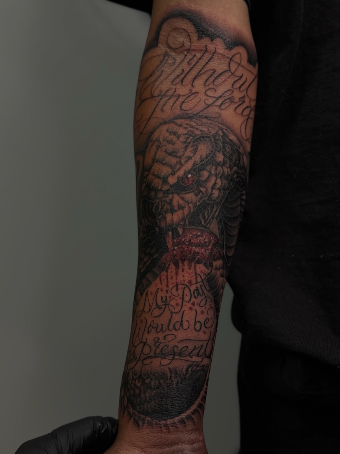 Dragon and script realism tattoo on the forearm by San Diego Tattoo Artist