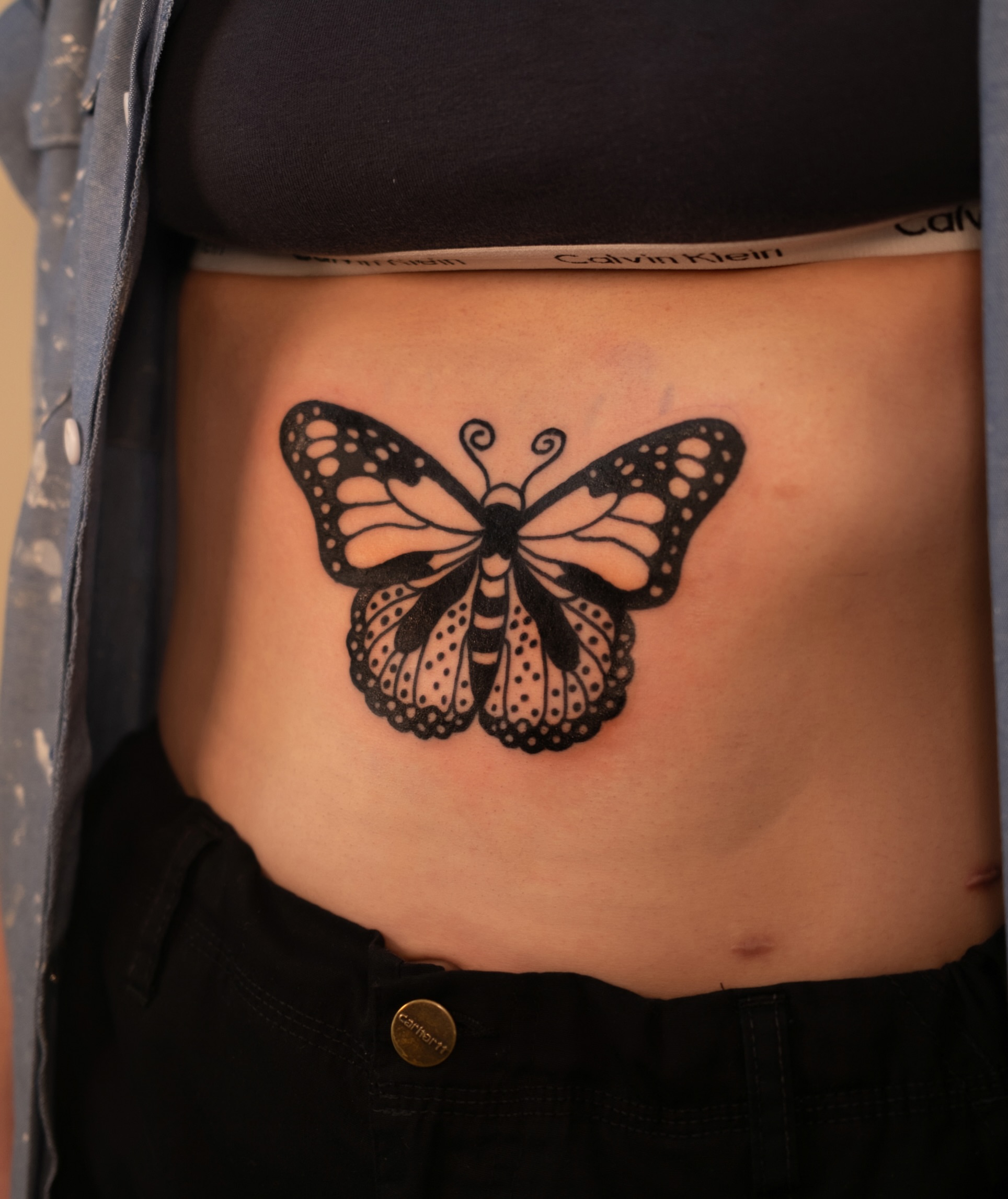 Butterfly black and grey tattoo on the torso by Neto Velasco - Sad Cat Tattoo, Austin, Texas