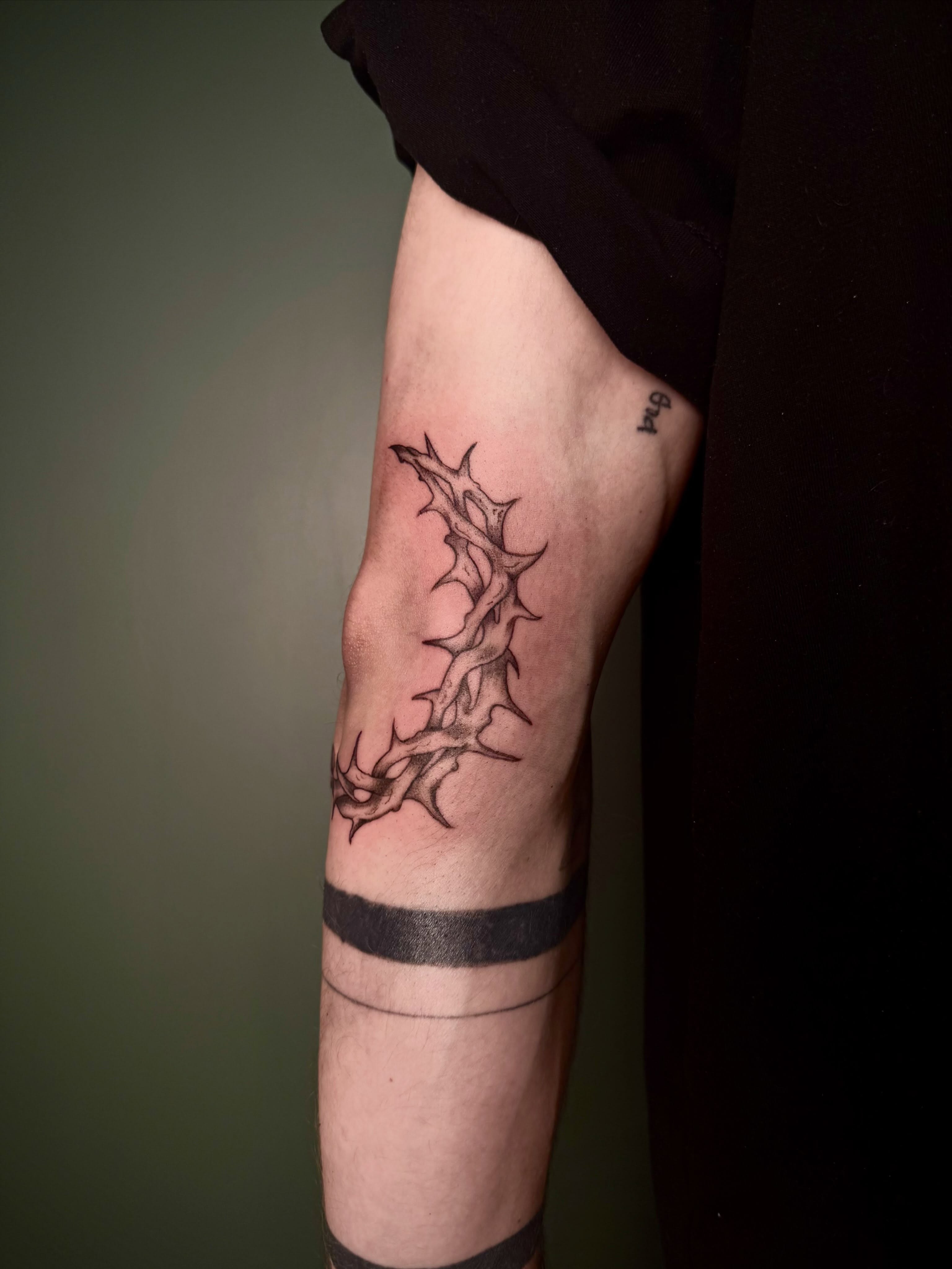 Thorn crown black and grey tattoo on the forearm by Bailee