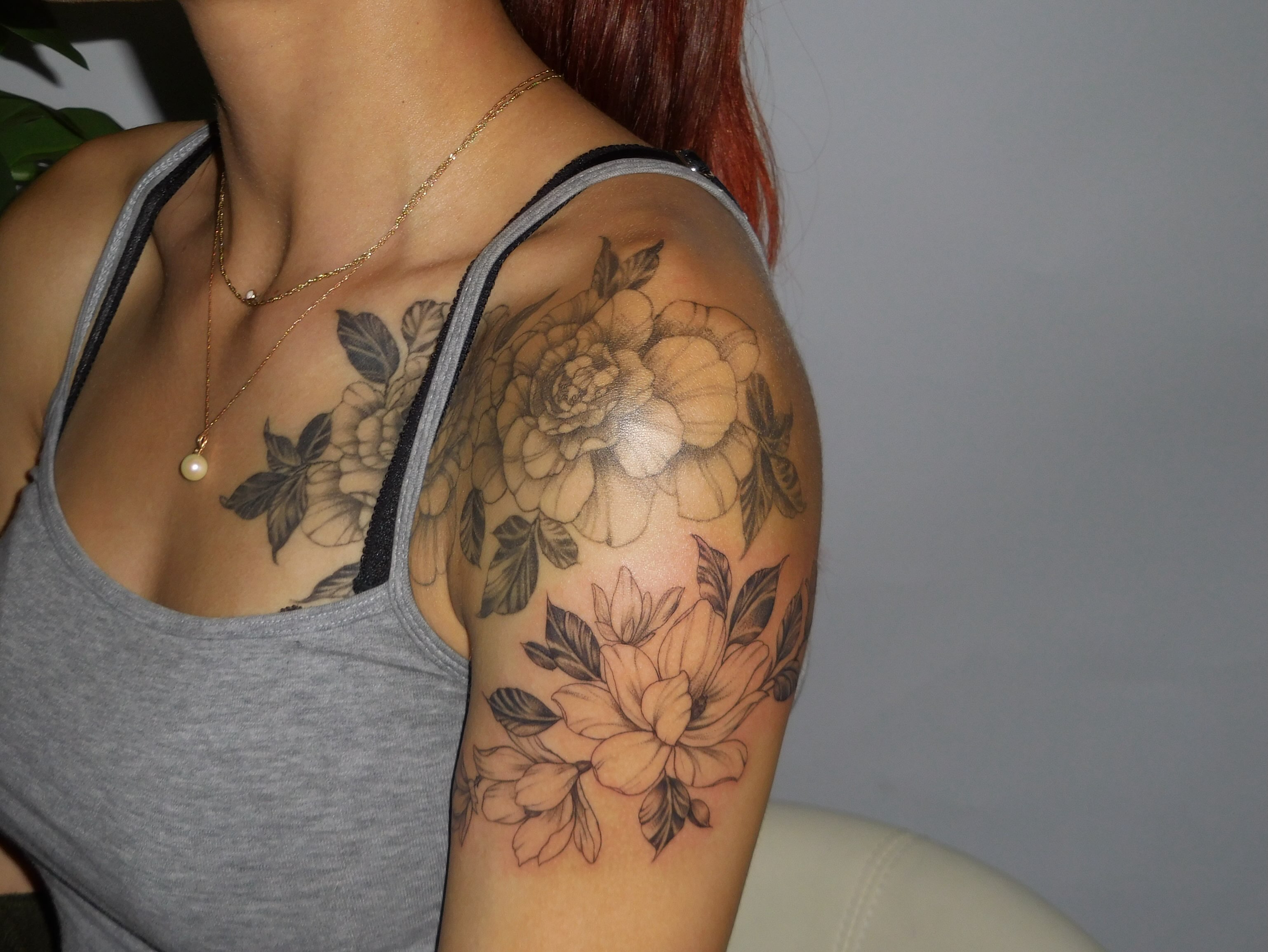 Floral bouquet black and grey tattoo on the shoulder by Nevaeh tattoo artist