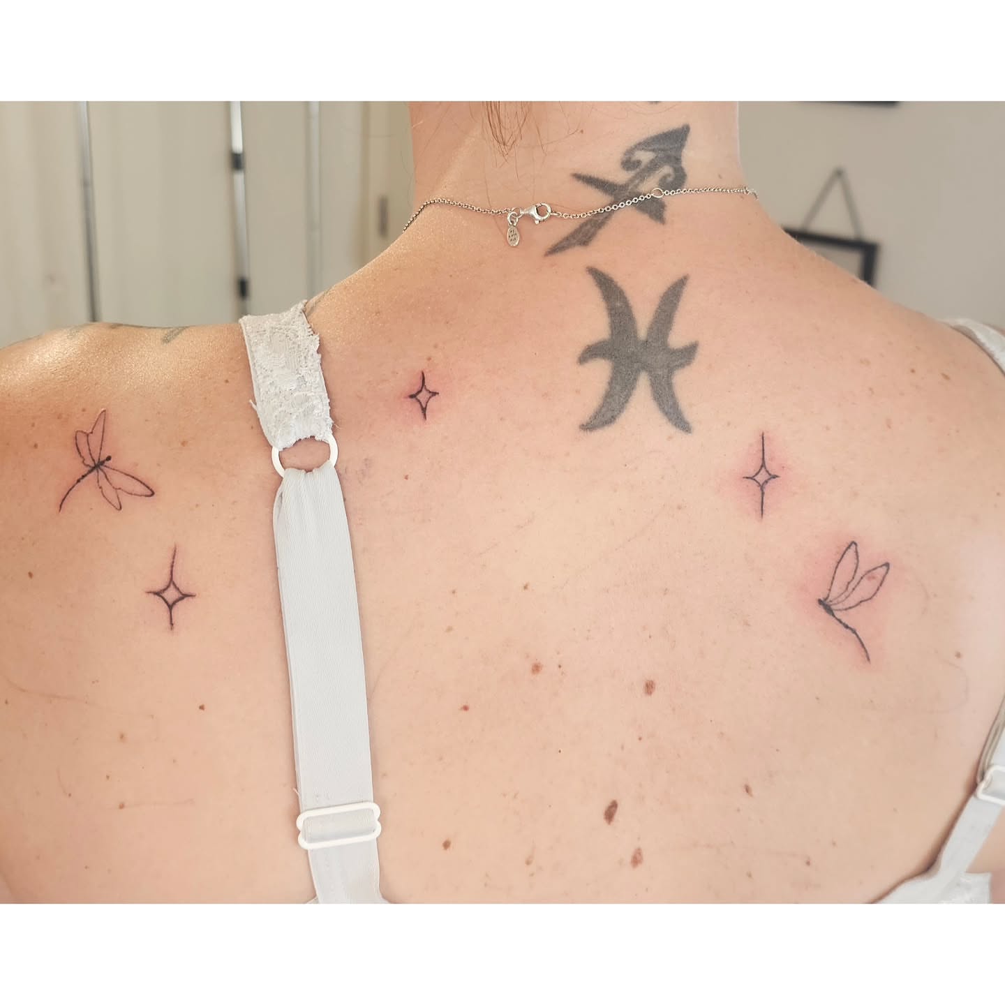 Astrological symbols black and grey tattoo on the back by The Fabled Tattooist (Alyssa Summers), Eagle Point, Oregon