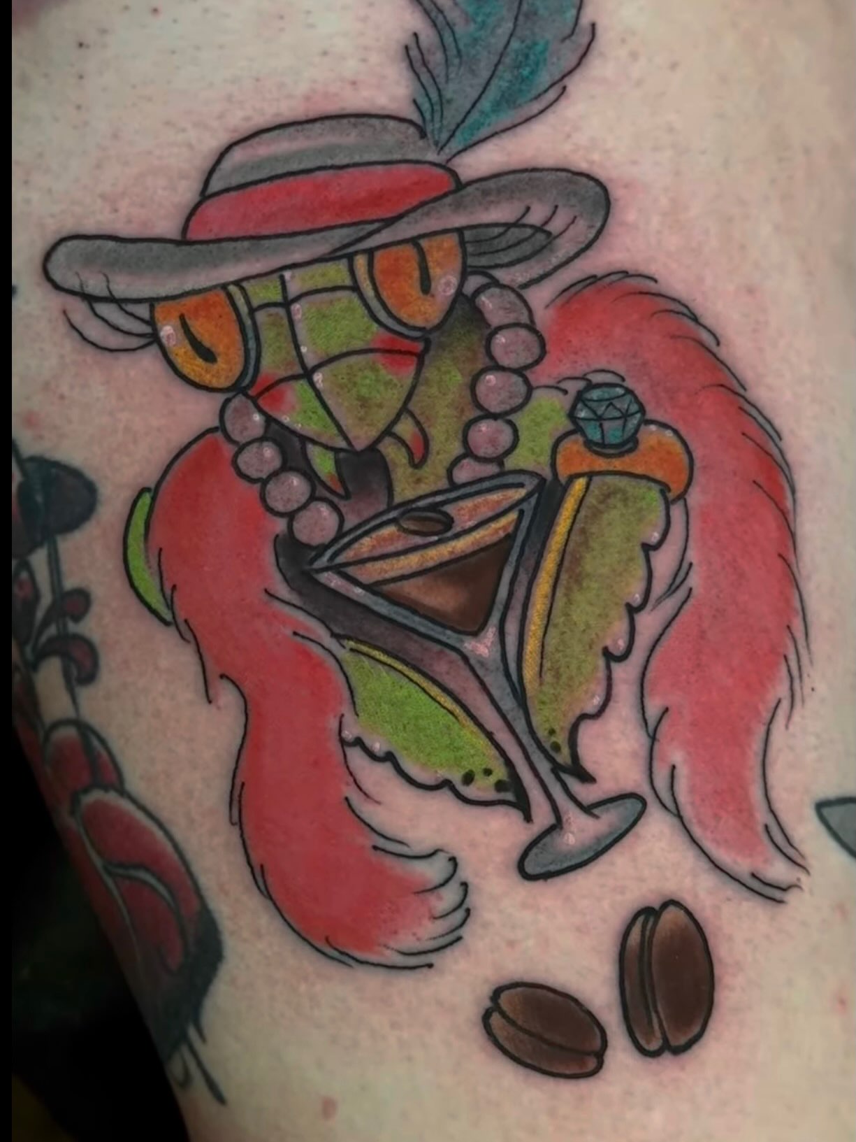 Lobster with cocktail American traditional tattoo on the upper arm by Sean Wilcox, Des Moines, Iowa