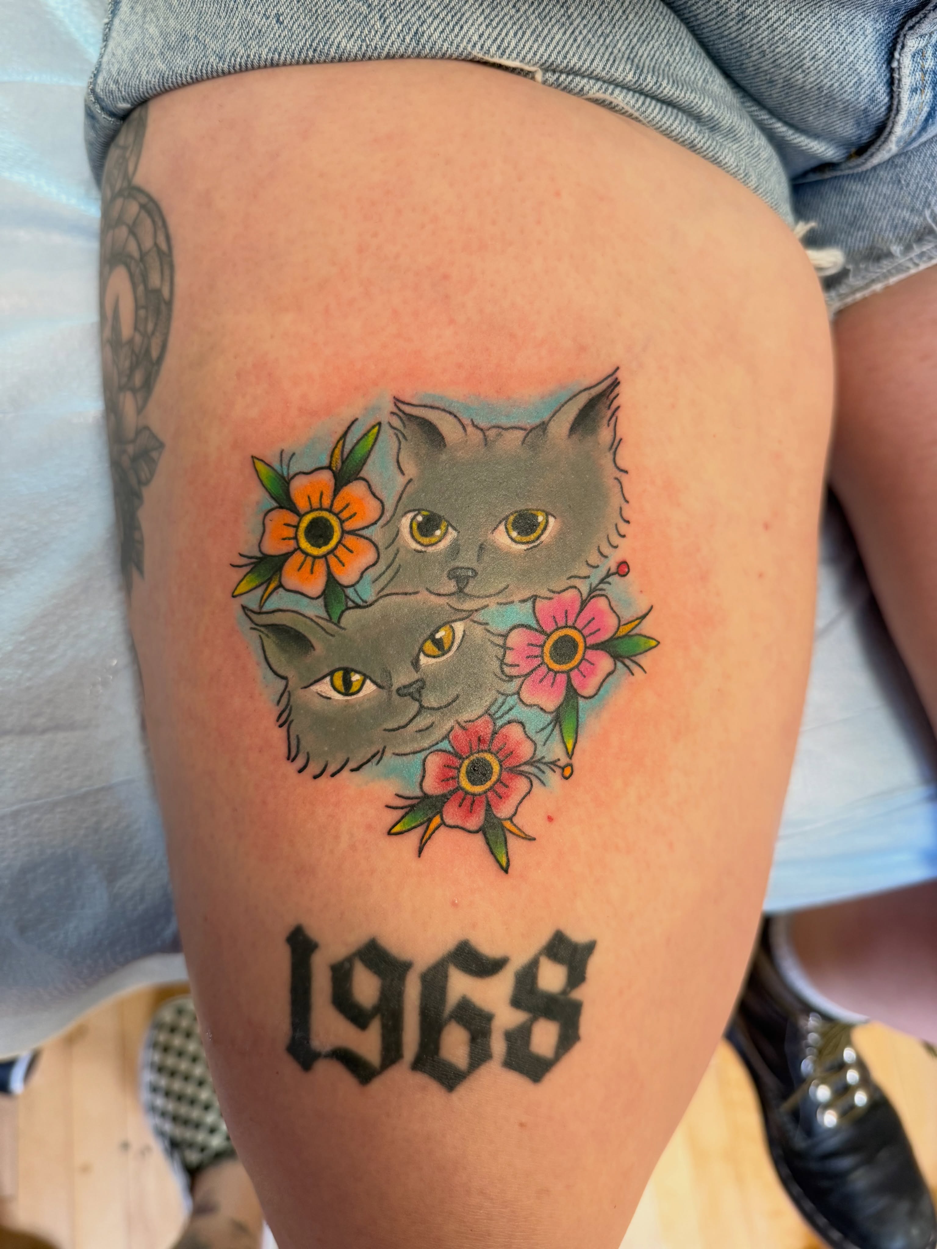 Cats and flowers American traditional tattoo on the thigh by Kelsey Lynn▪️Raleigh Tattoo Artist