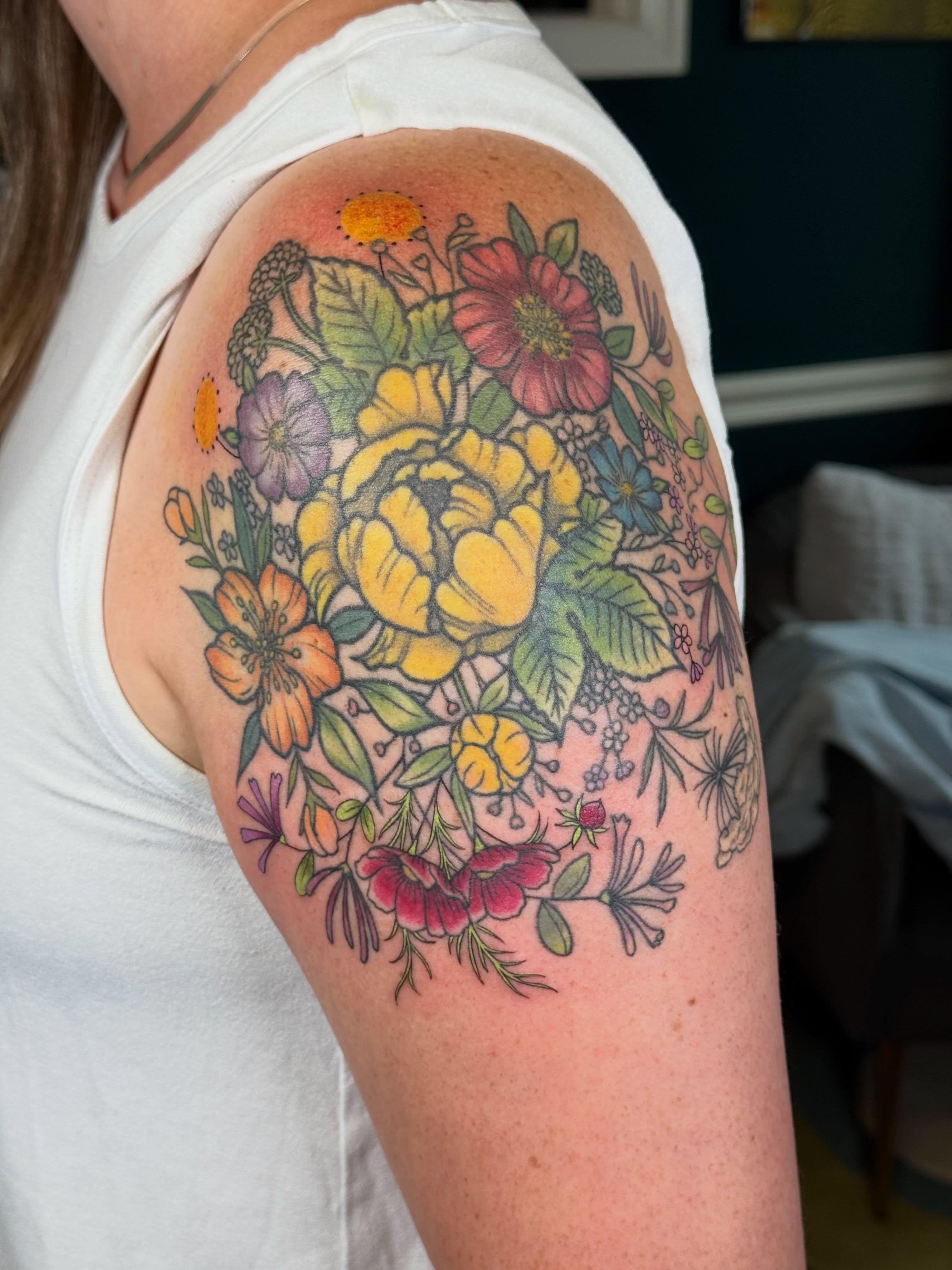 Floral bouquet new school tattoo on the shoulder by Larkin Resler