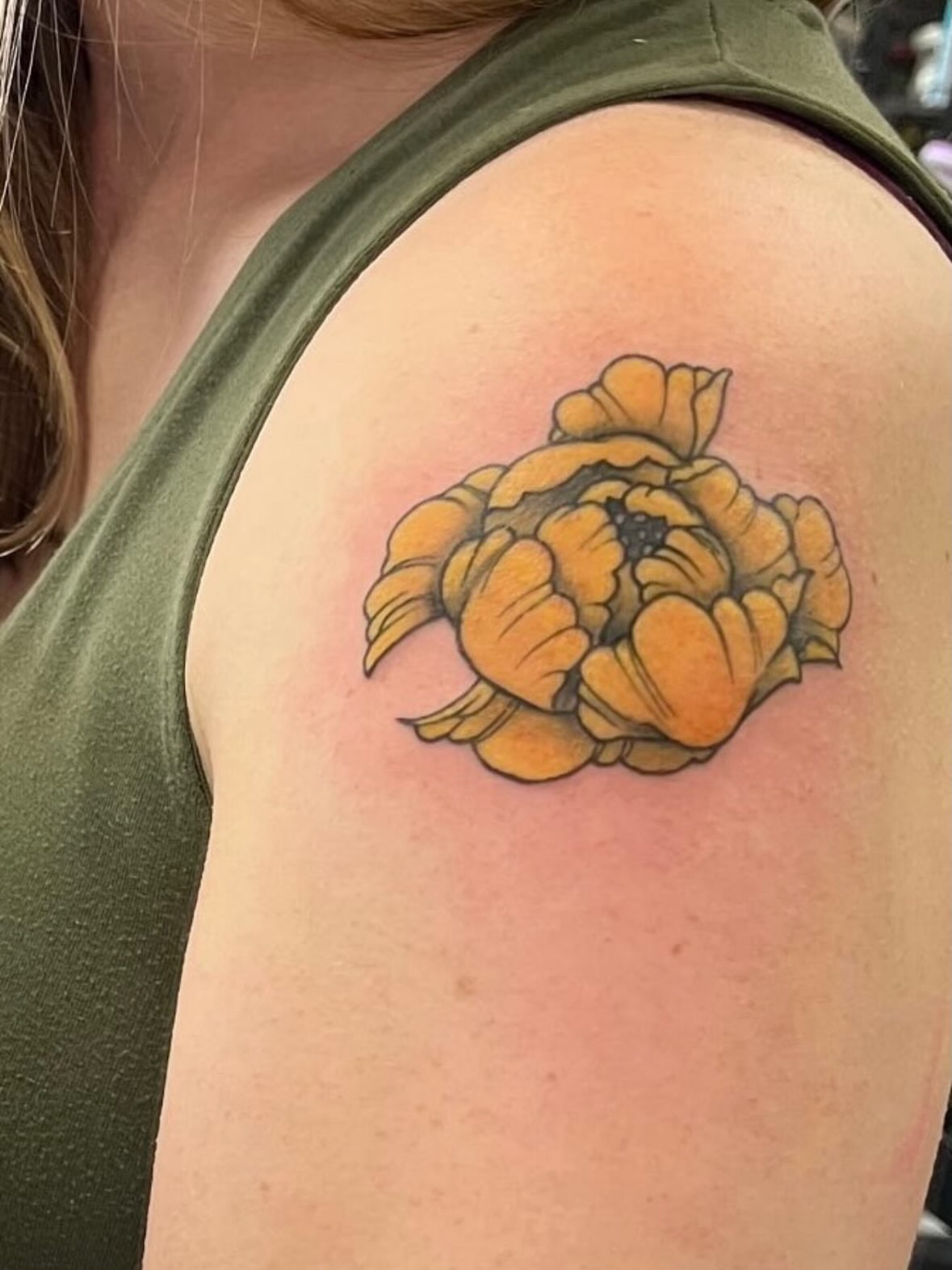 Peony American traditional tattoo on the shoulder by Larkin Resler