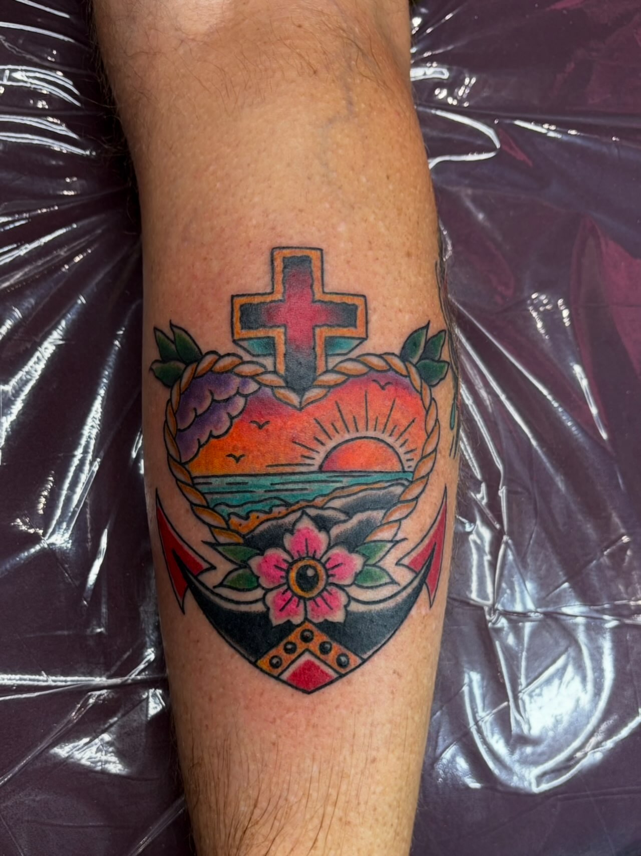 Sunset over ocean American traditional tattoo on the forearm by @rayscott_tattoo